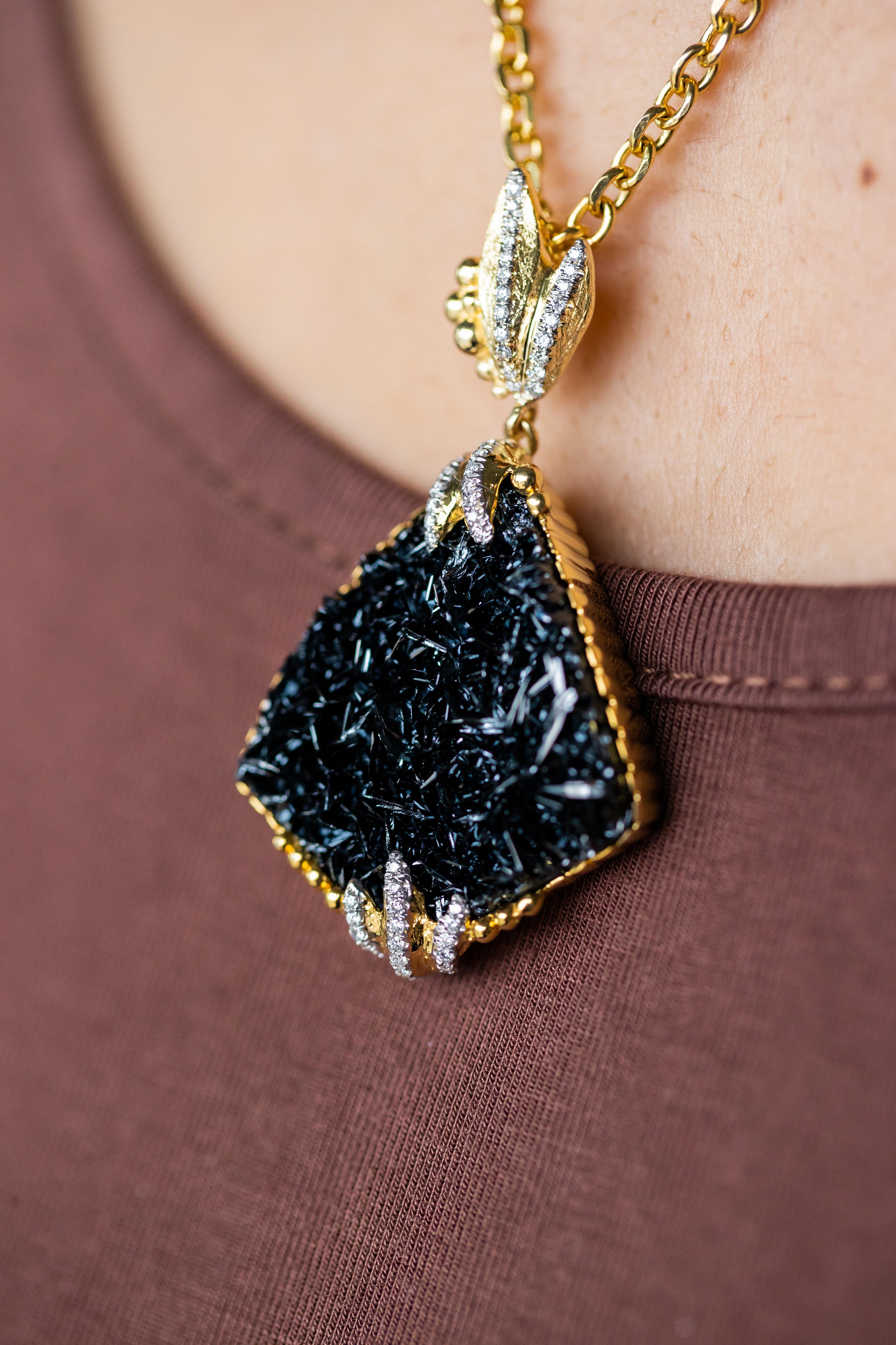 Immerse yourself in the opulent allure of this exquisite 18K yellow gold pendant, a masterful creation by the acclaimed designer Victor Velyan. This luxurious piece features a captivating 72.71-carat hematite, known for its deep, metallic luster and