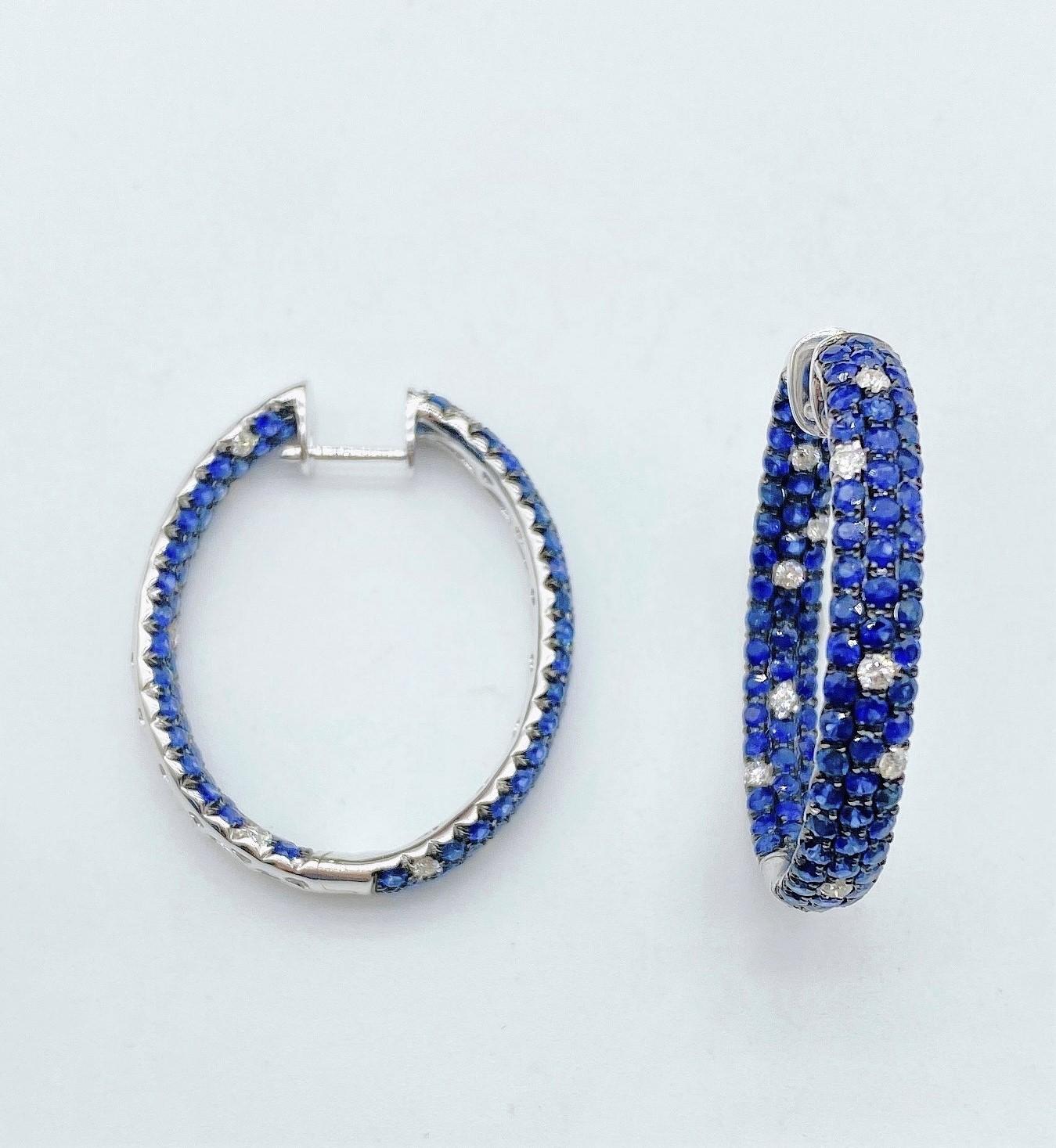 The Following Items we are offering is a Rare Important Radiant Pair of 18KT Gold Large Glistening Magnificent Large Fancy Blue Sapphire and Diamond Hoop Earrings. Stones are Very Clean and Extremely Fine! T.C.W. Approx 5.50CTS!!! 

Comes New with