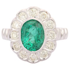 Magnifique bague fleur en or blanc massif 18 carats avec émeraudes et diamants