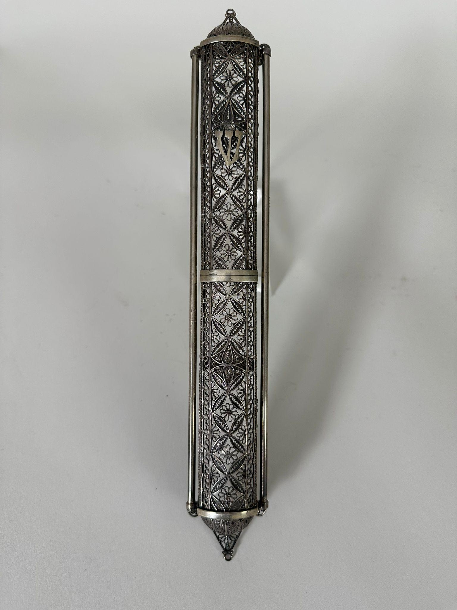 This stunning, large handmade Mezuzah case was crafted in Jerusalem in the 1950s by the renowned artist Zadok. Made of sterling silver, as marked with the 925 stamp, the piece showcases intricate filigree work with delicate floral and geometric