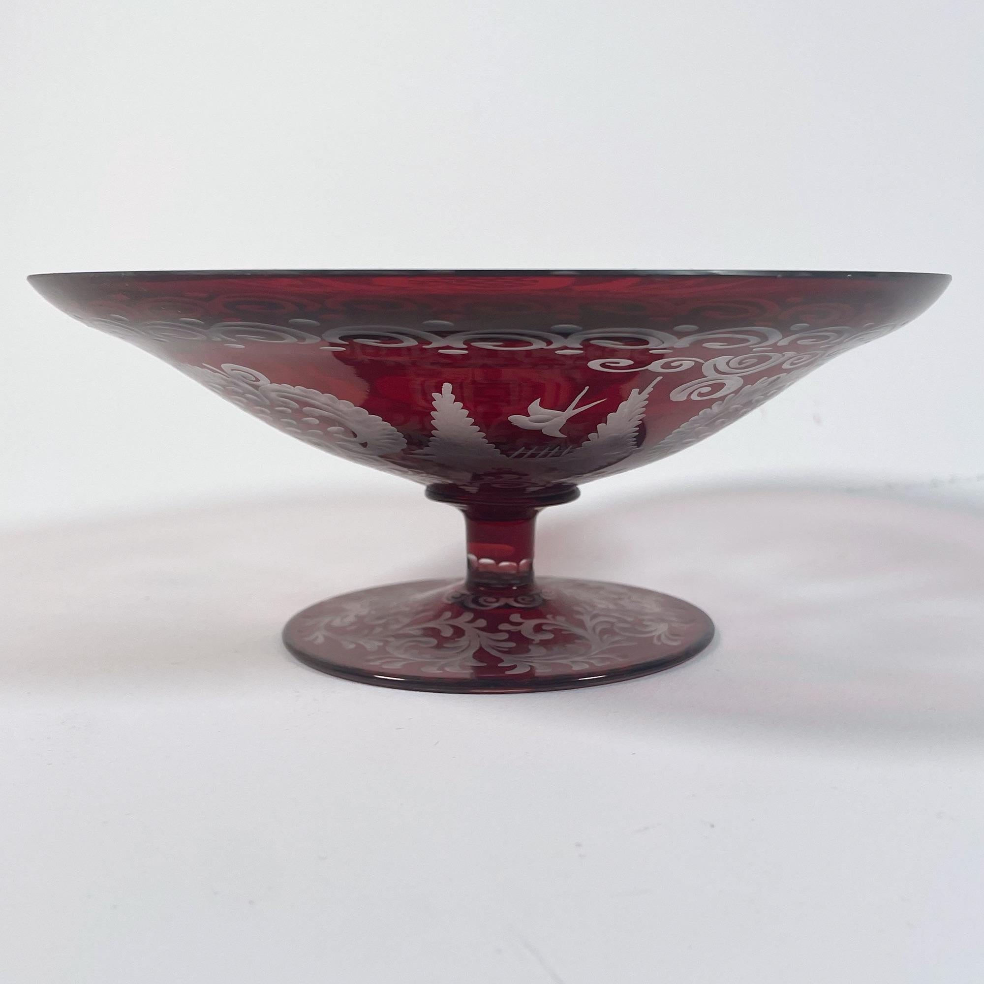 Elevate your home decor with this stunning 1950s red cut glass bowl, a remarkable piece of Bohemian craftsmanship. With a diameter of 18 cm and a height of 7 cm, this bowl showcases intricate cut designs that reflect light beautifully, creating a