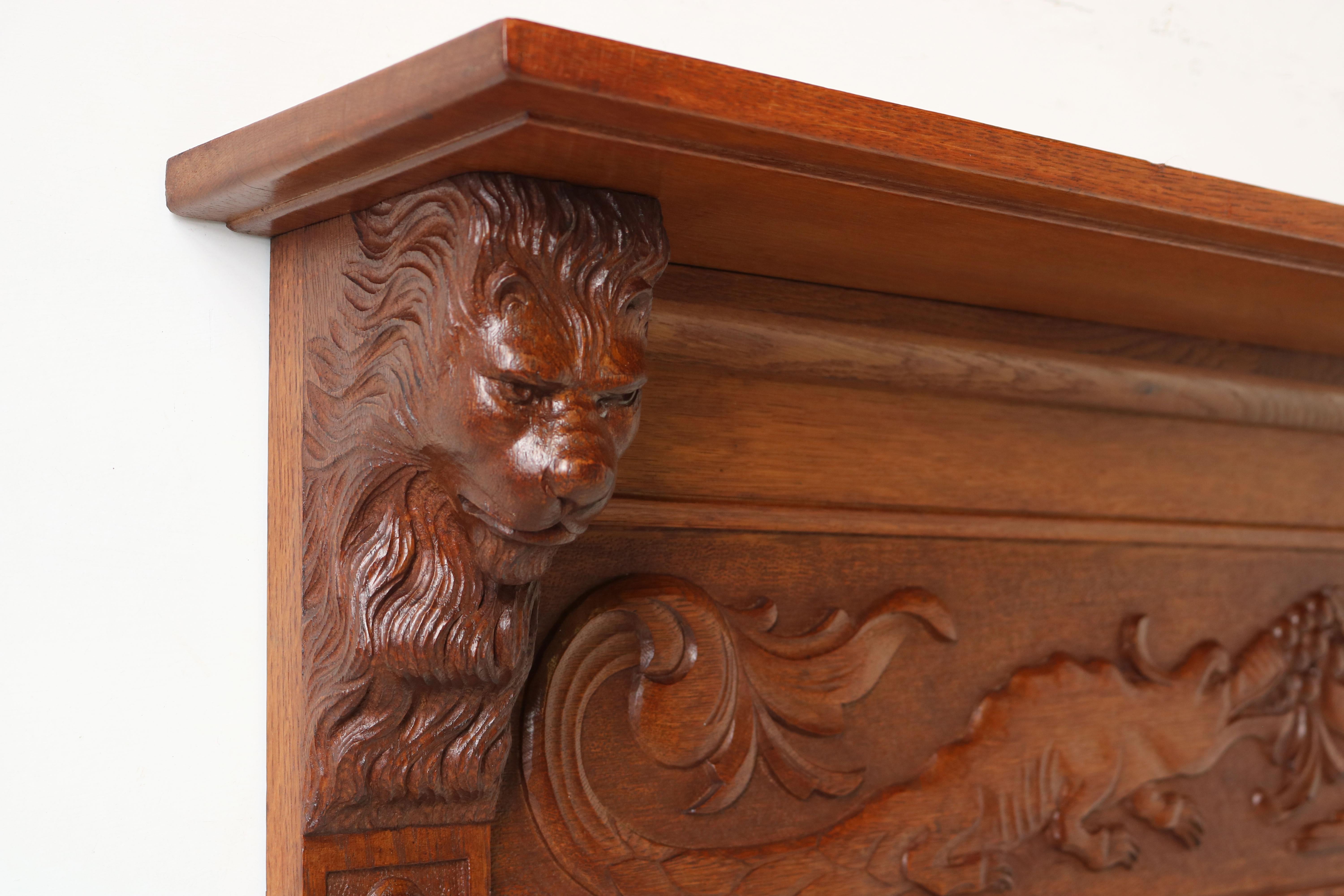 Exquisite & breathtaking! This 19th century French Renaissance Revival coat / hat rack with lion masks. 
Carved by a master carver out of solid European oak these 2 lion heads are just simply breathtaking. 
Very rare unusual scene displaying