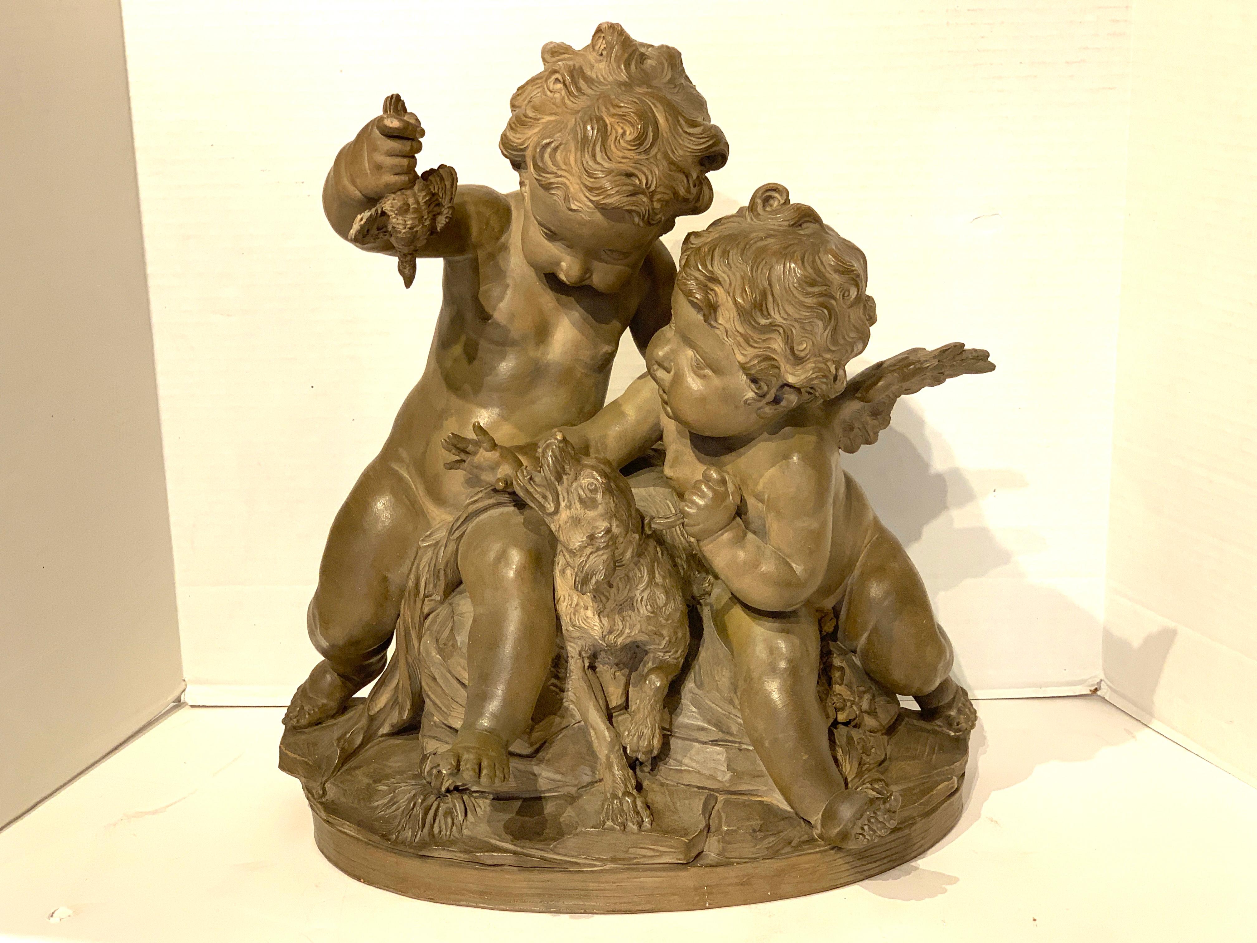 Exquisite 19th century French terracotta grouping in the style of Clodion, unusual subject of mortal (wingless) putto, holding a bird, tempting a dog, with winged Angel to the right. Beautifully detailed and modeled, warm original patina, unmarked.