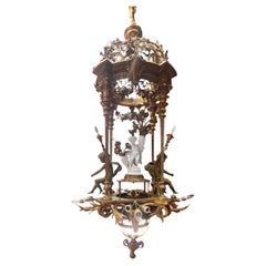 Exquisite 19th Century Gilt Bronze French Chandelier with Bisque Cherub Exquisite 19th Century Gilt Bronze French Chandelier with Bisque Cherub