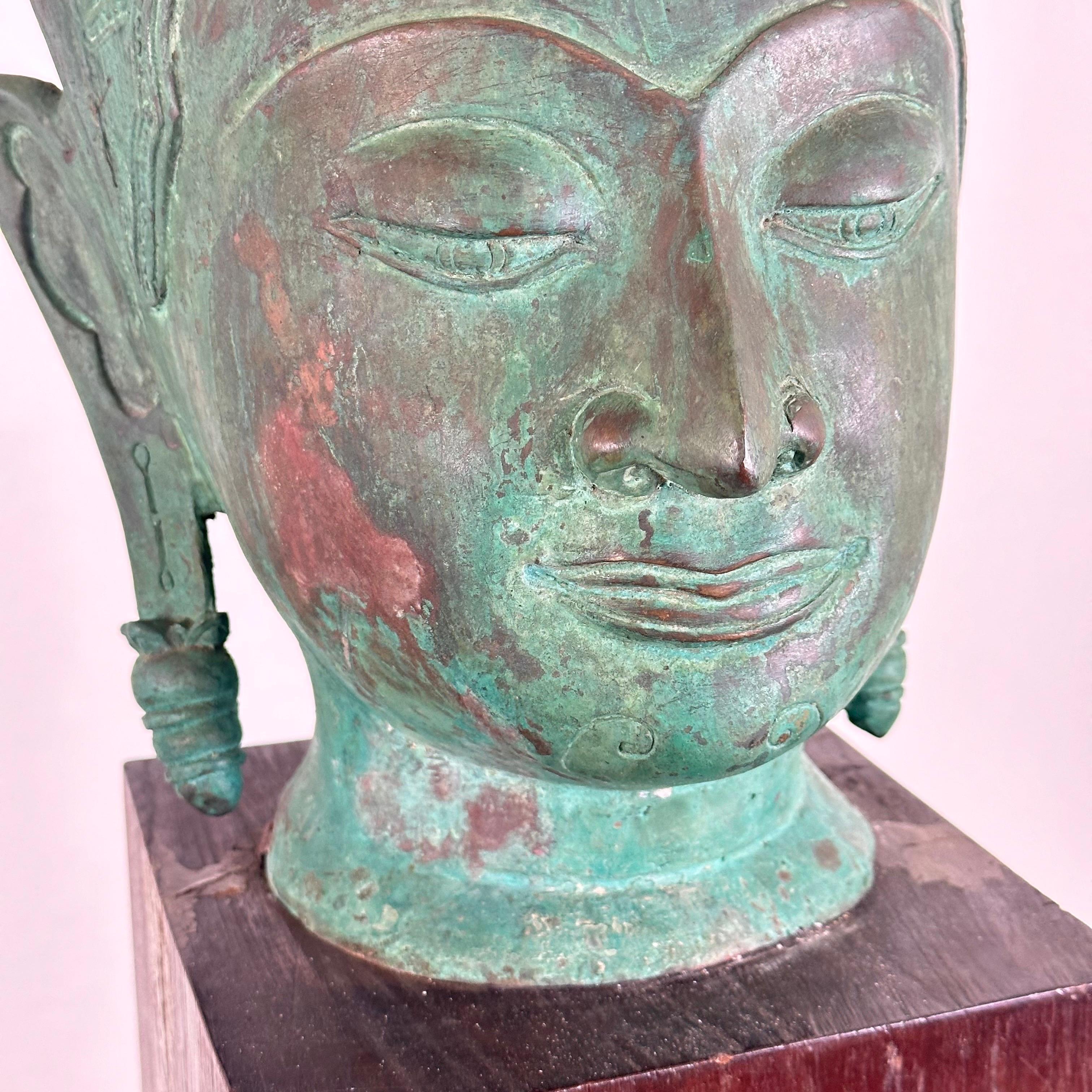 Mid-19th Century Exquisite 19th Century Thai Bronze Buddha Head on Wooden Base For Sale