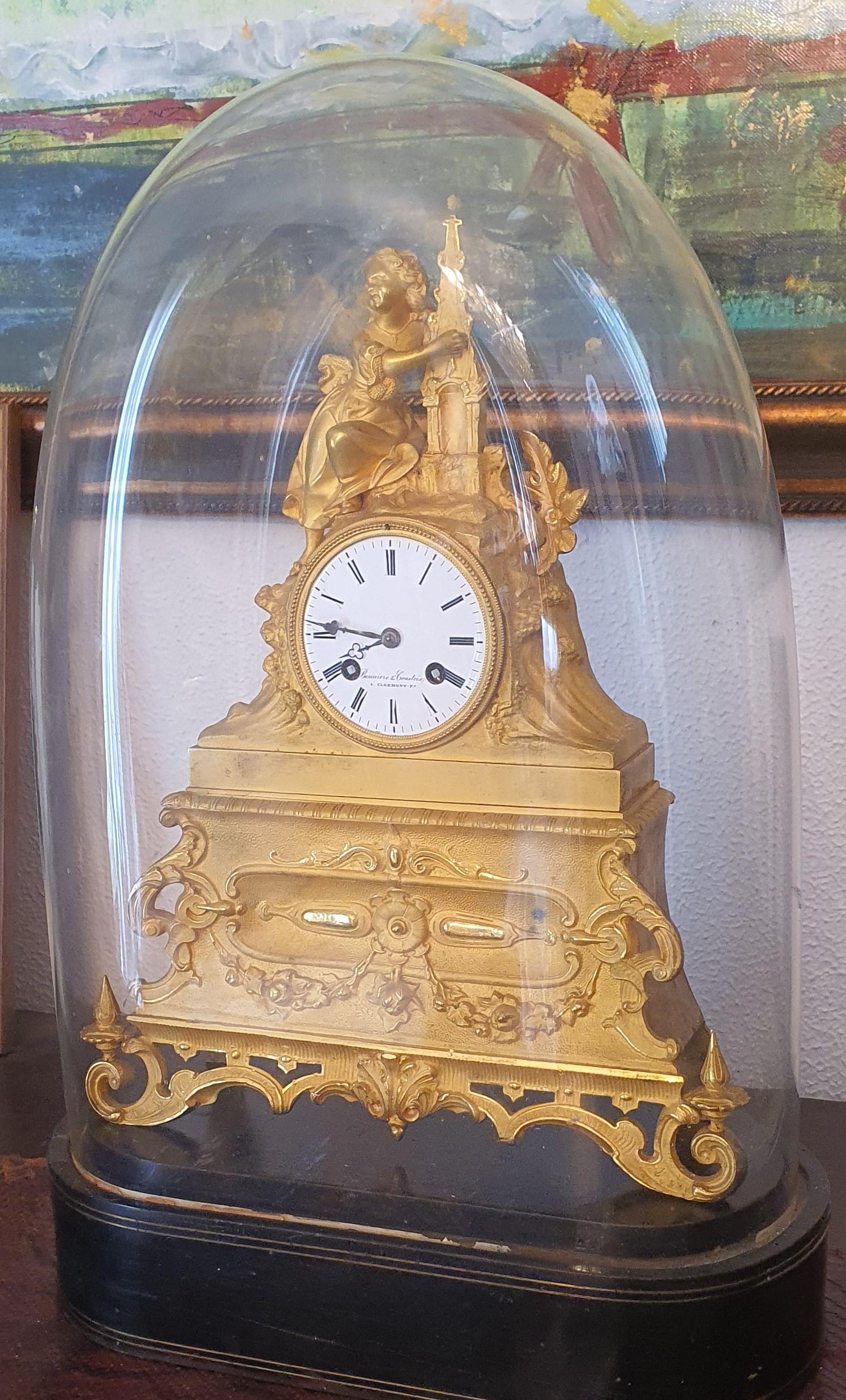 Exquisite gothic revival ormolu mantle clock depicting a young girl holding a gothic spire by Pierre-César Honoré Pons 1827 

This clock has the extremely rare feature of retaining the original handblown glass case on ebony veneered base. 

This