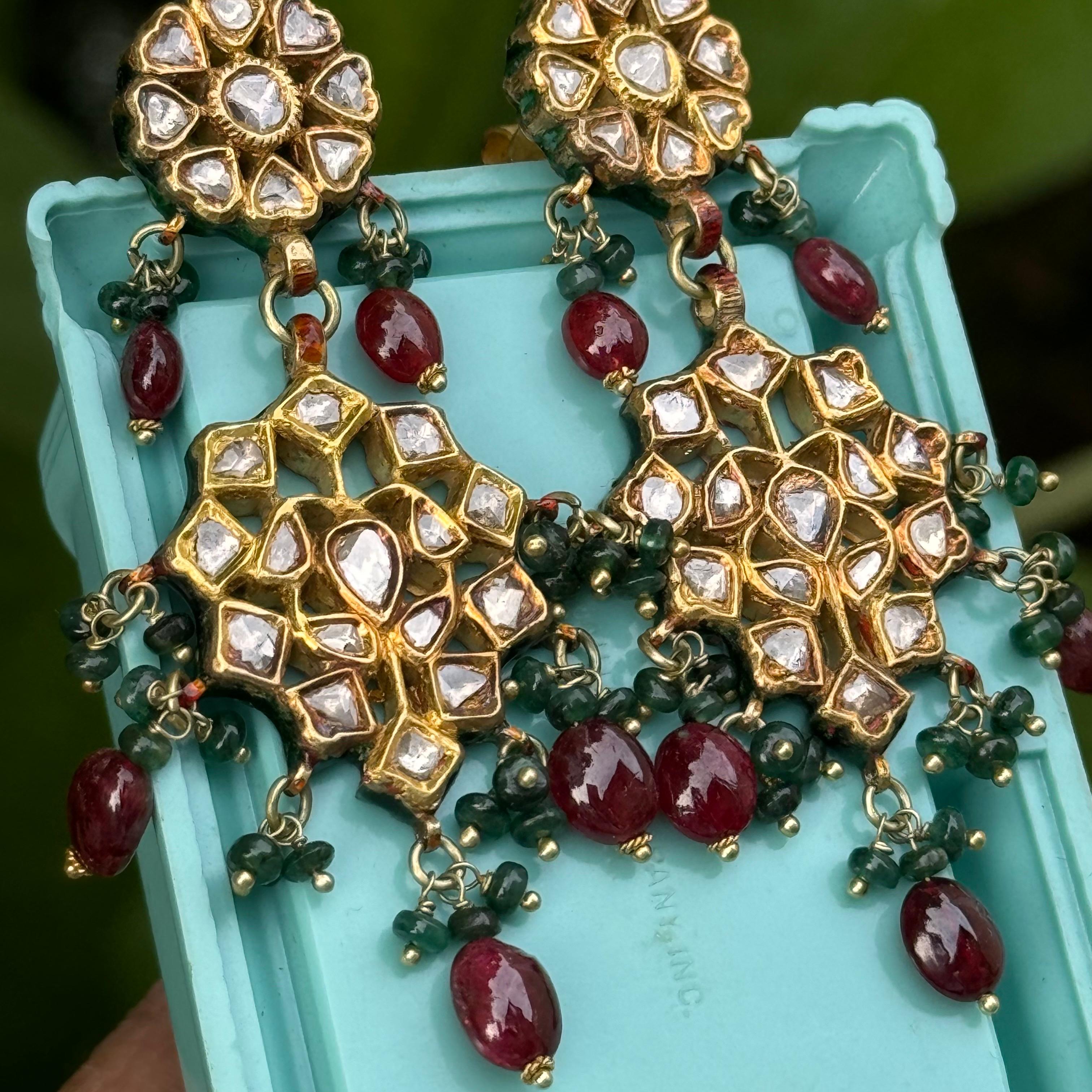 Elevate your elegance with these breathtaking Mughal-inspired dangle earrings. Crafted from luxurious 20kt gold, these earrings feature a stunning array of gemstones and intricate details that showcase exceptional artistry. These type of Mughal