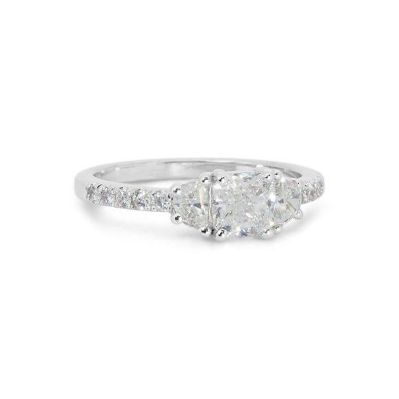 This ring transcends mere jewelry, it's a captivating masterpiece of brilliance and grace. The centerpiece is a dazzling 1.5 carat cushion modified brilliant diamond, boasting the coveted D color (colorless) and VVS2 clarity (minute inclusions