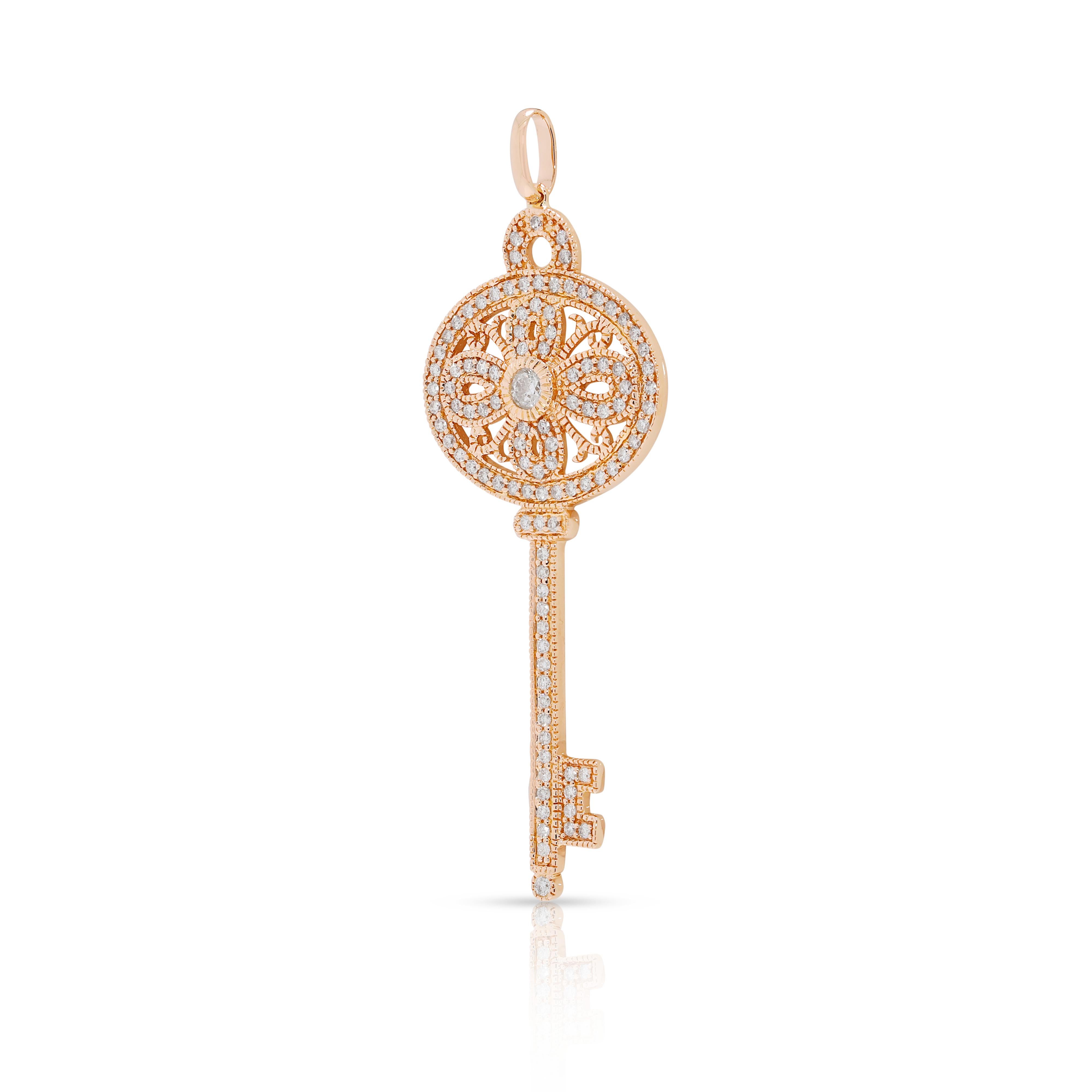 Unlock timeless elegance with this dazzling key-shaped pendant, intricately crafted in 18K rose gold and set with 105 round brilliant natural diamonds totaling 2.33ct. The warm blush tone of the gold beautifully enhances the sparkle of G-H color,