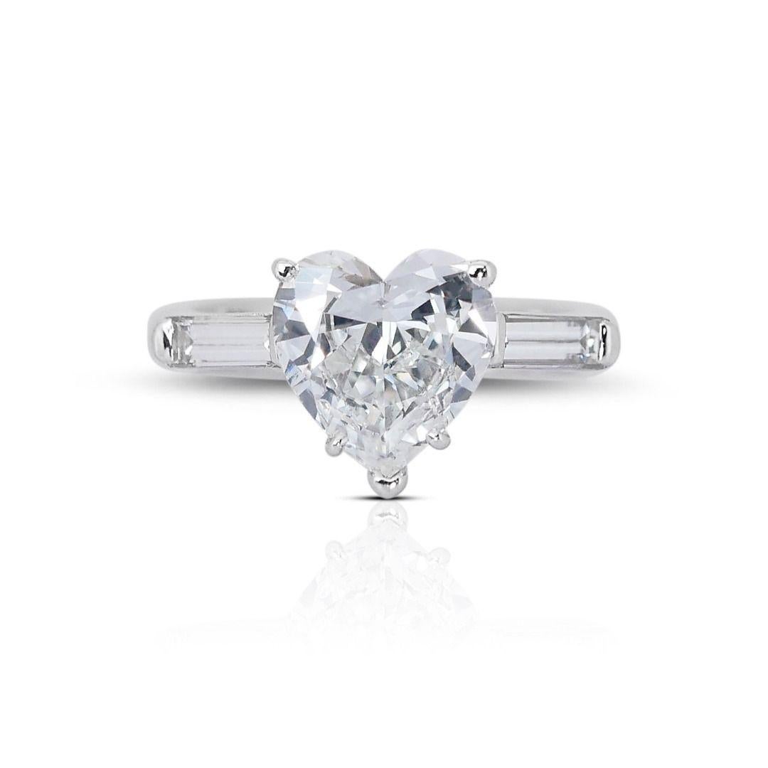 This exquisite ring features a dazzling 2.53-carat heart brilliant natural diamond as its centerpiece, complemented by 0.6 carat of sparkling baguette side diamonds. Crafted from gleaming 18K white gold, this exceptional piece exudes elegance and