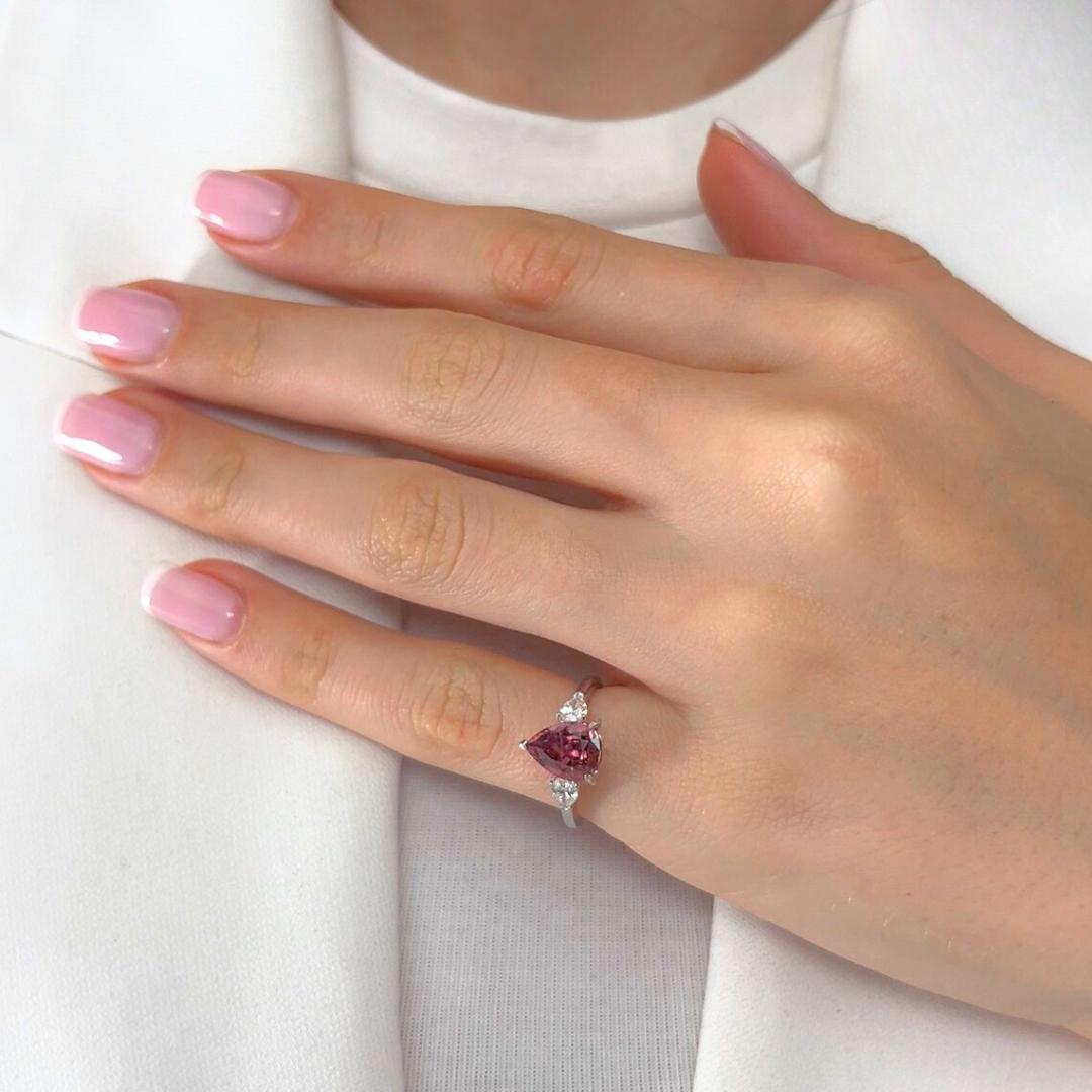 Exquisite 2.56ct Rubellite and Diamonds 3-Stone Ring in Platinum - IGI Certified

A graceful fusion of color and clarity, this platinum 3-stone ring features a stunning 2.01ct pear-shaped rubellite in a vivid pink hue—radiating warmth and elegance.