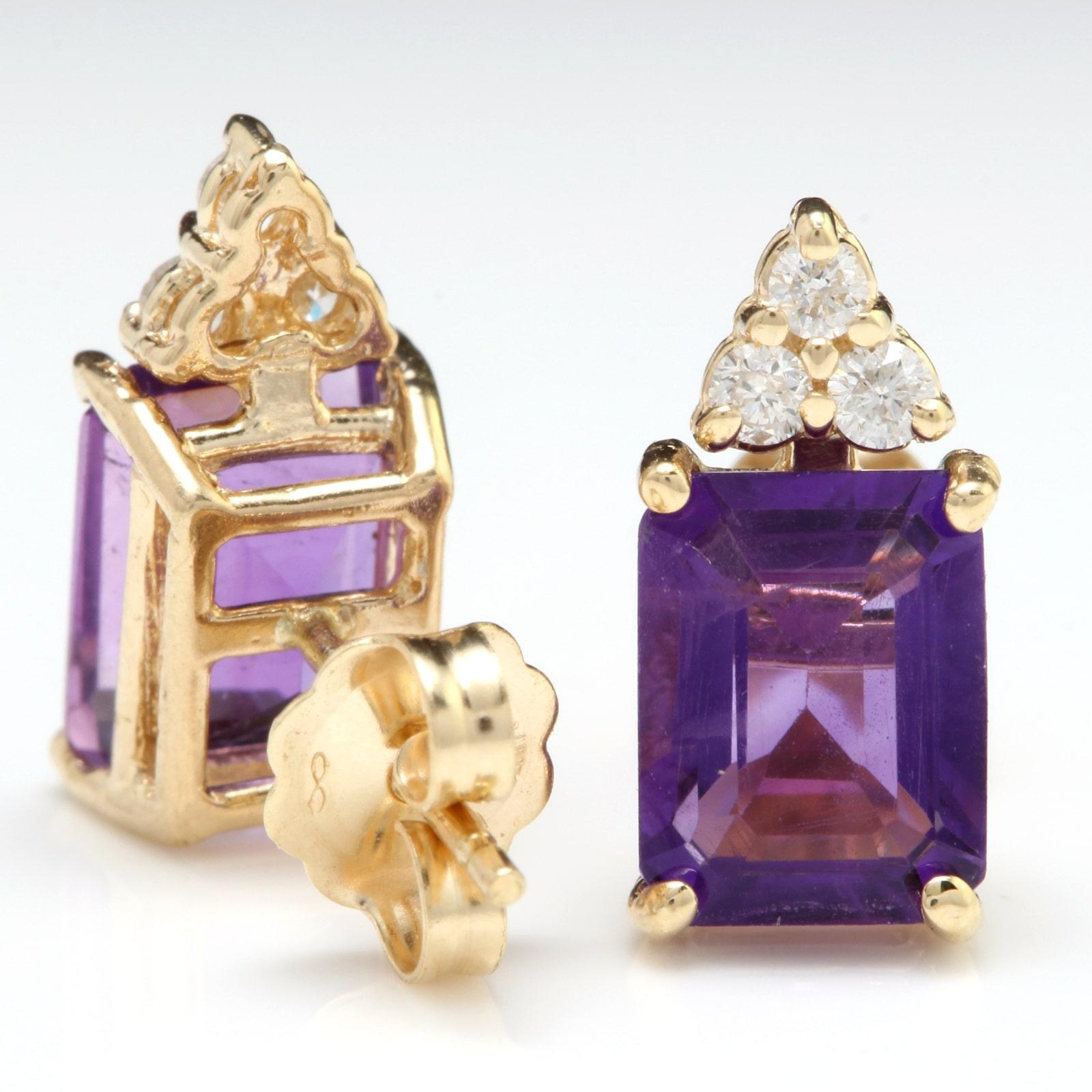 Exquisite 3.20 Carats Natural Amethyst and Diamond 14K Solid Yellow Gold Earrings

Amazing looking piece!

Total Natural Round Cut White Diamonds Weight: Approx. 0.20 Carats (color G-H / Clarity SI1-SI2)

Total Natural Emerald Cut Amethyst Weight: