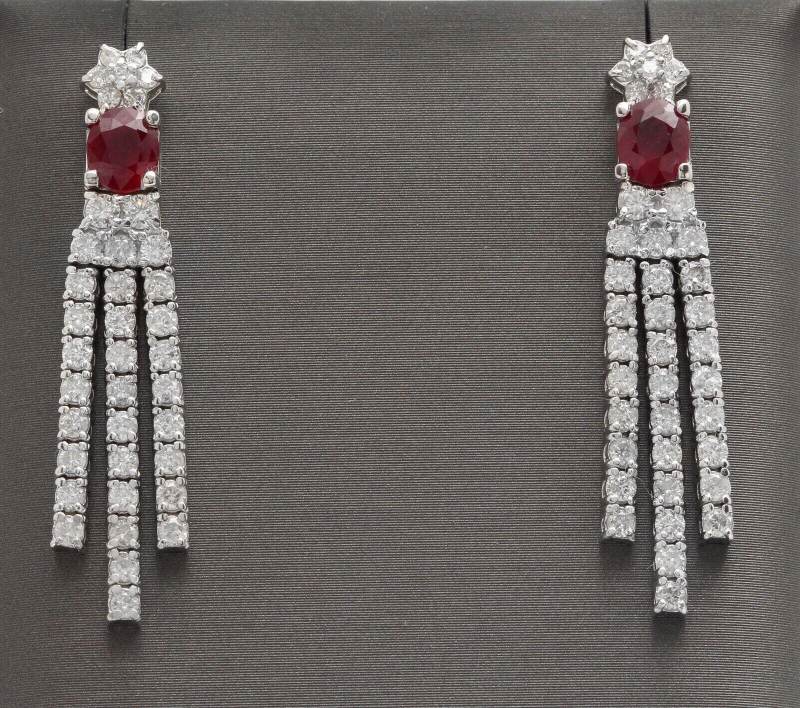 Exquisite 3.80 Carats Natural Red Ruby and Diamond 14K Solid White Gold Dangling Earrings

Amazing looking piece! 

Suggested Replacement Value $8,000.00

Total Natural Round Cut White Diamonds Weight: Approx. 2.20 Carats (color G-H / Clarity SI)