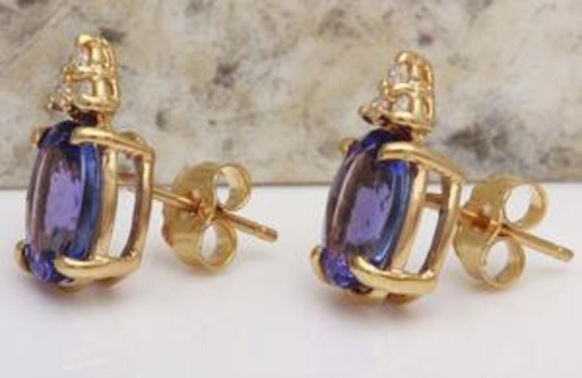 Oval Cut Exquisite 4.18 Carat Natural Tanzanite and Diamond 14 Karat Solid Gold Stud For Sale