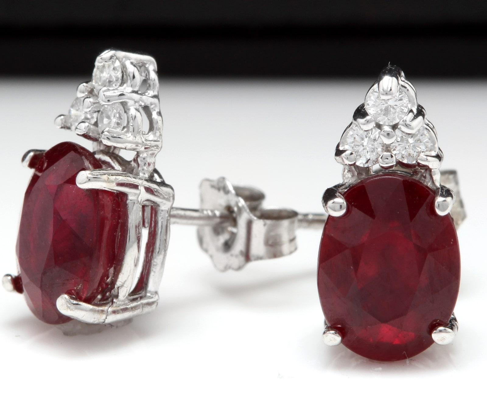 Exquisite 4.20 Carats Red Ruby and Natural Diamond 14K Solid White Gold Stud Earrings

Amazing looking piece!

Total Natural Round Cut White Diamonds Weight: .20 Carats (color G-H / Clarity SI2)

Total Oval Cut Red Rubies Weight: 4.00 Carats (Lead