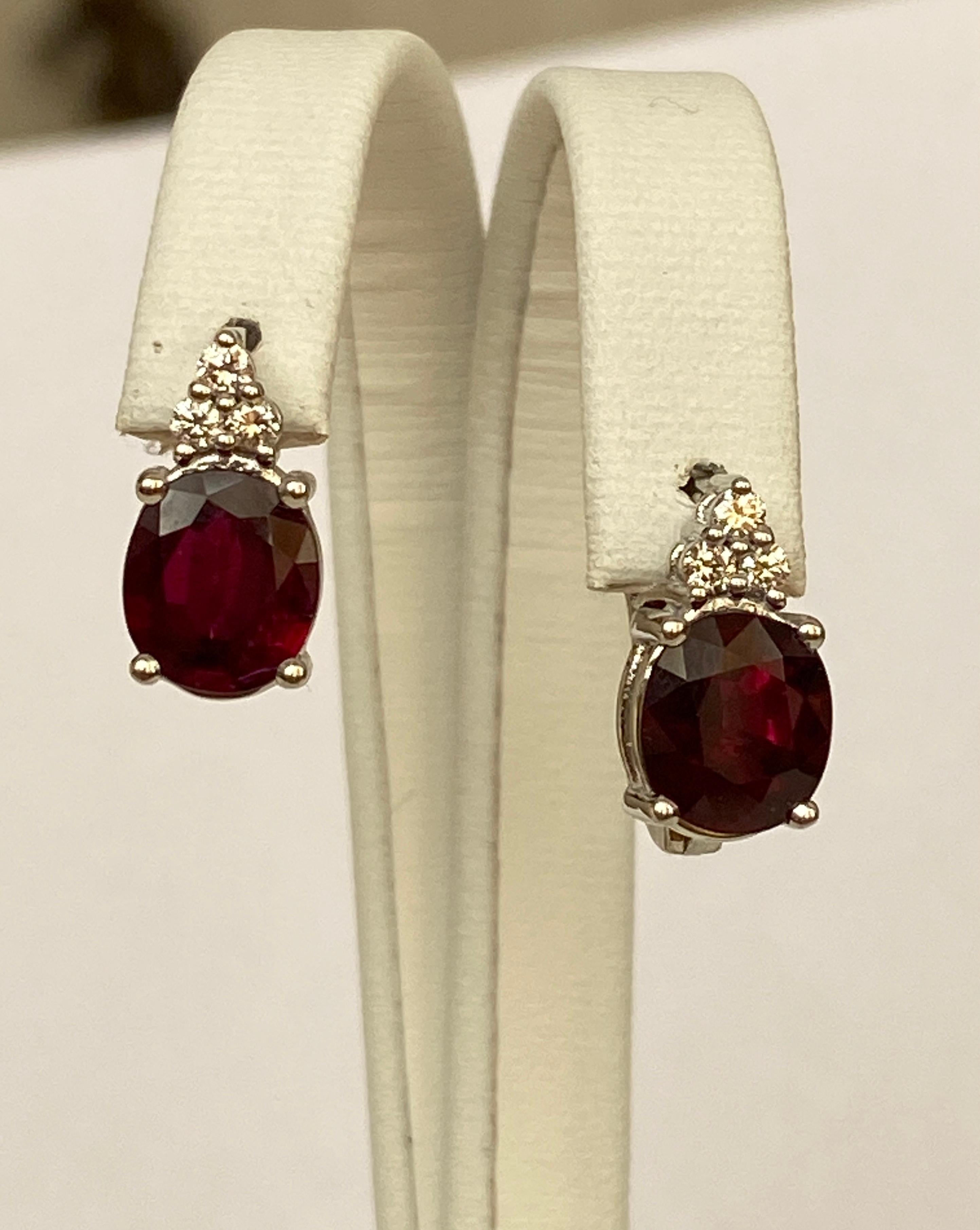 These timeless stud earrings feature a perfectly matched pair of oval Madagascar.  A specially selected pair of different shades of rich red gives these earrings an unforgettable charm. Rubies with exceptional color and clarity beneath round