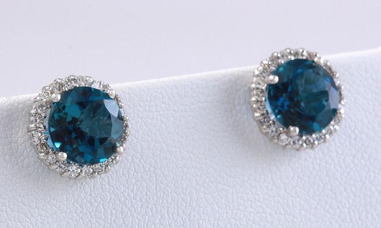 Exquisite 4.55 Carats Natural London Blue Topaz and Diamond 14K Solid White Gold Stud Earrings

Amazing looking piece!

Total Natural Round Cut White Diamonds Weight: .45 Carats (color G-H / Clarity SI1-SI2)

Total Natural Round Cut London Blue