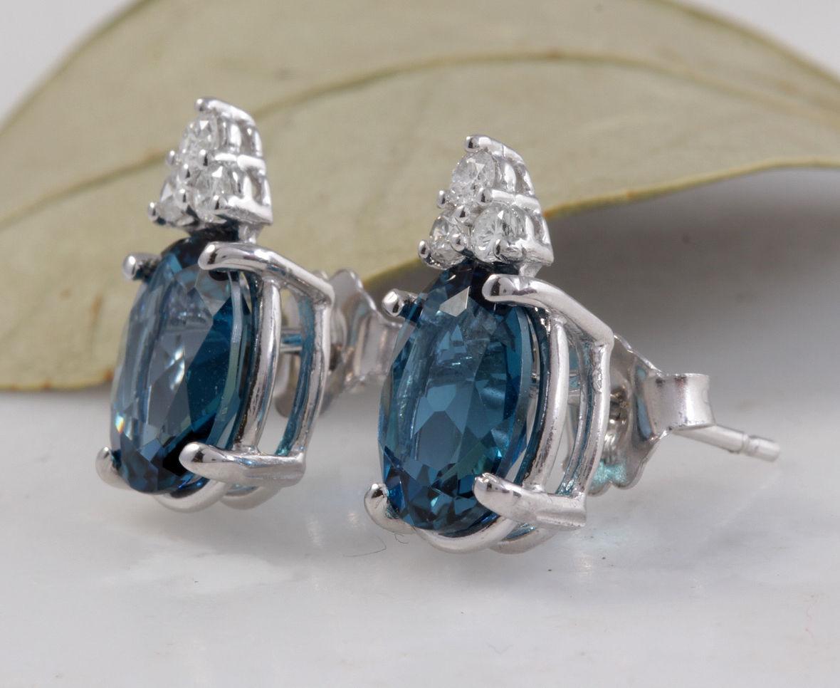 Exquisite 4.60 Carats London Blue Topaz and Diamond 14K Solid White Gold Stud Earrings

Amazing looking piece!

Total Natural Round Cut White Diamonds Weight: .20 Carats (color G-H / Clarity SI2)

Total Oval Cut London Blue Topazes Weight: Approx.
