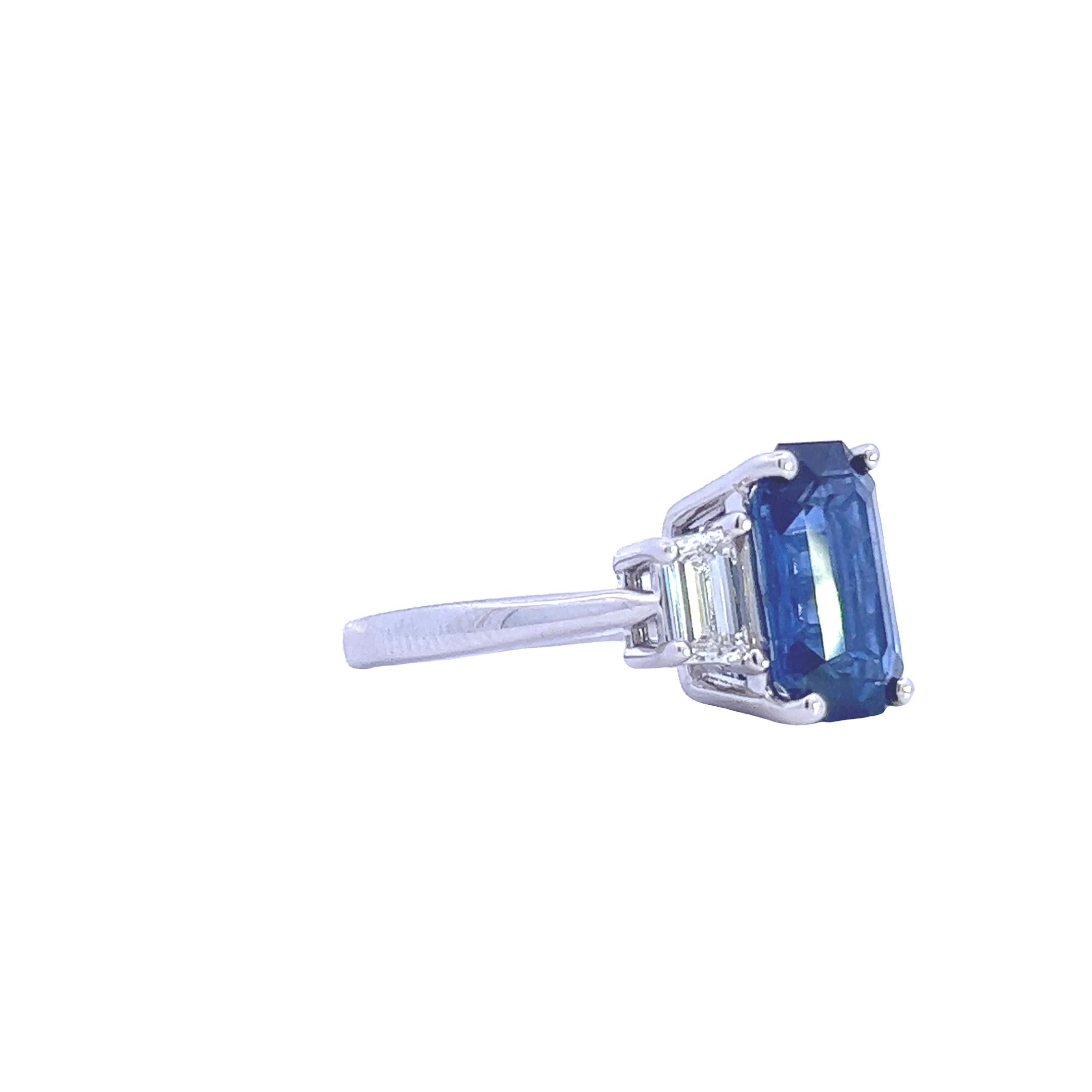 Indulge in the ultimate luxury with this extraordinary 5.25ct sapphire and 0.75ct diamond ring, meticulously crafted in 18k white gold. The centerpiece of this masterpiece is a natural corundum sapphire, boasting a remarkable 5.25 carats of pure
