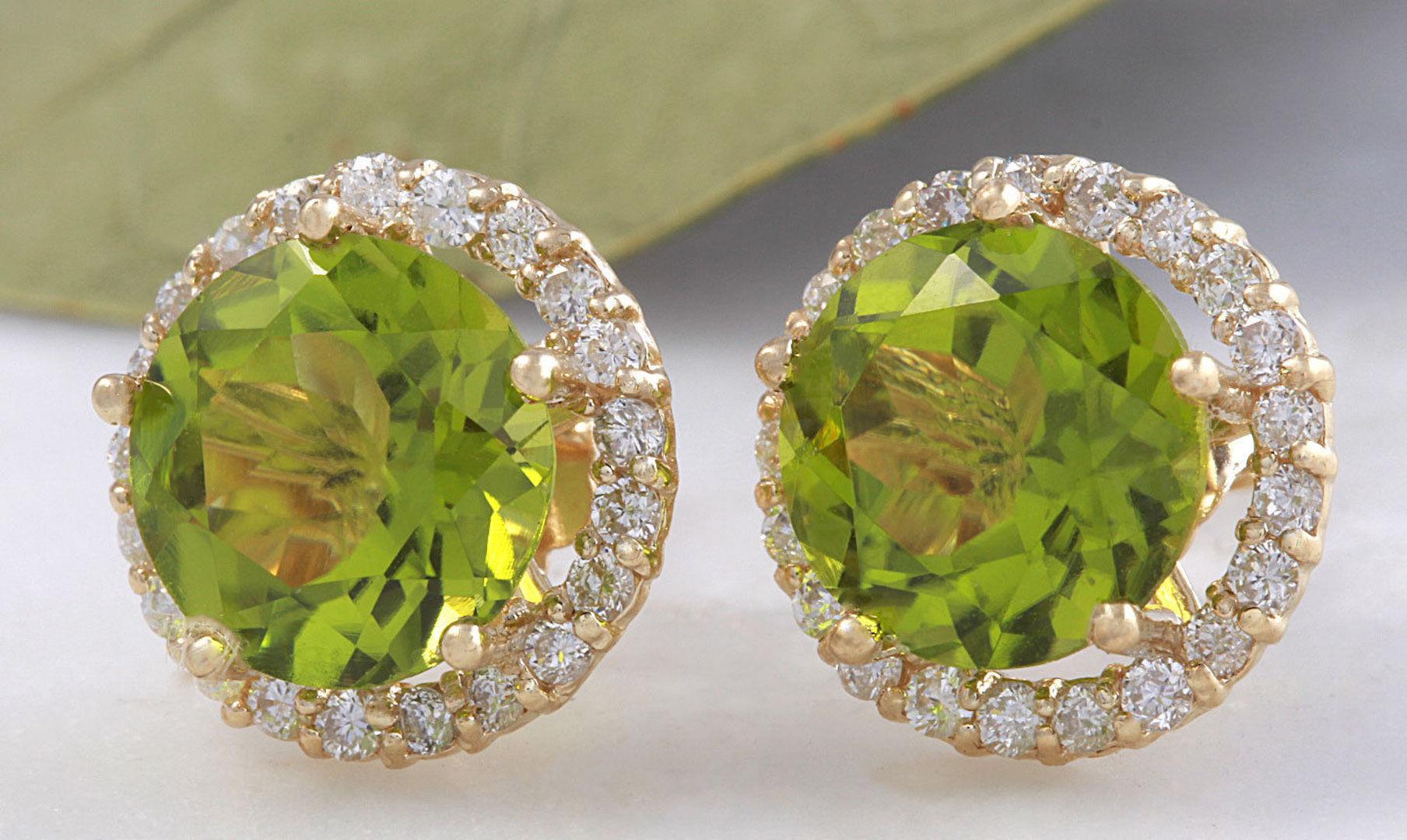 Exquisite 6.12 Carats Natural Green Peridot and Diamond 14K Solid Yellow Gold Stud Earrings

Amazing looking piece!

Total Natural Round Cut White Diamonds Weight: .60 Carats (color G-H / Clarity SI1-SI2)

Total Natural Round Cut Green Peridots