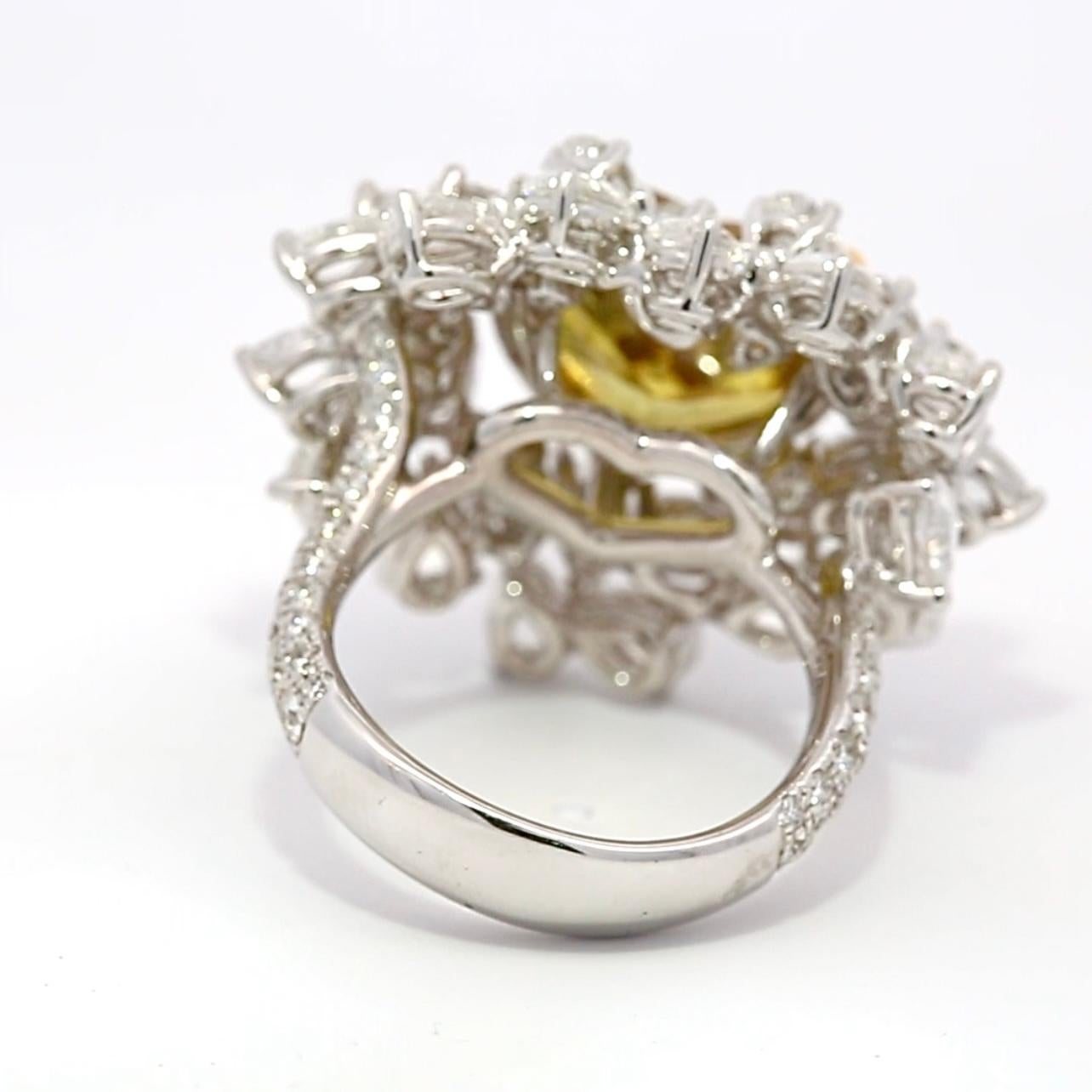 Discover unparalleled elegance with this extraordinary 7.30 carat heart-shaped green diamond ring, a true masterpiece of luxury and craftsmanship. The unique green diamond, with its captivating hue and brilliant heart shape, serves as the