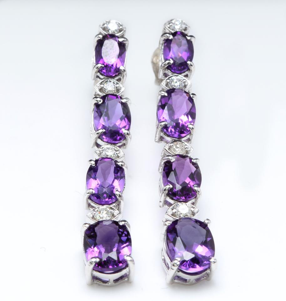 Exquisite 7.40 Carats Natural Amethyst and Diamond 14K Solid White Gold Earrings

Amazing looking piece!

Total Natural Round Cut White Diamonds Weight: Approx. 0.40 Carats (color G-H / Clarity SI1-SI2)

Total Natural Oval Cut Amethyst Weight: 7.00
