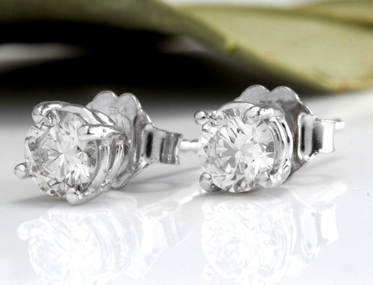 Exquisite .80 Carats Natural Diamond 14K Solid White Gold Stud Earrings

Amazing looking piece!

Total Natural Round Cut Diamonds Weight: .80 Carats (both earrings) SI1 / H-I

Diamond Measures: 4.7mm

Total Earrings Weight is: 1.2 grams

Disclaimer: