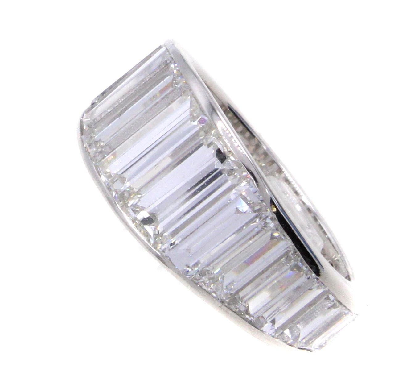 This unique and masterfully handcrafted platinum eternity band is set with 26 in size graduating white and bright baguette cut diamonds, with a total diamond weight of 8.10 carats. Each diamond in this band has been perfectly cut to fit next to the