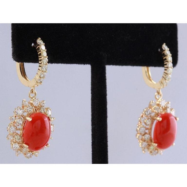 Exquisite 8.40 Carats Natural Red Coral and Diamond 14K Solid Yellow Gold Earrings

Amazing looking piece!

Total Natural Round Cut White Diamonds Weight: Approx. 2.00 Carats (color G-H / Clarity SI1-SI2)

Total Natural Oval Cut Corals Weight: