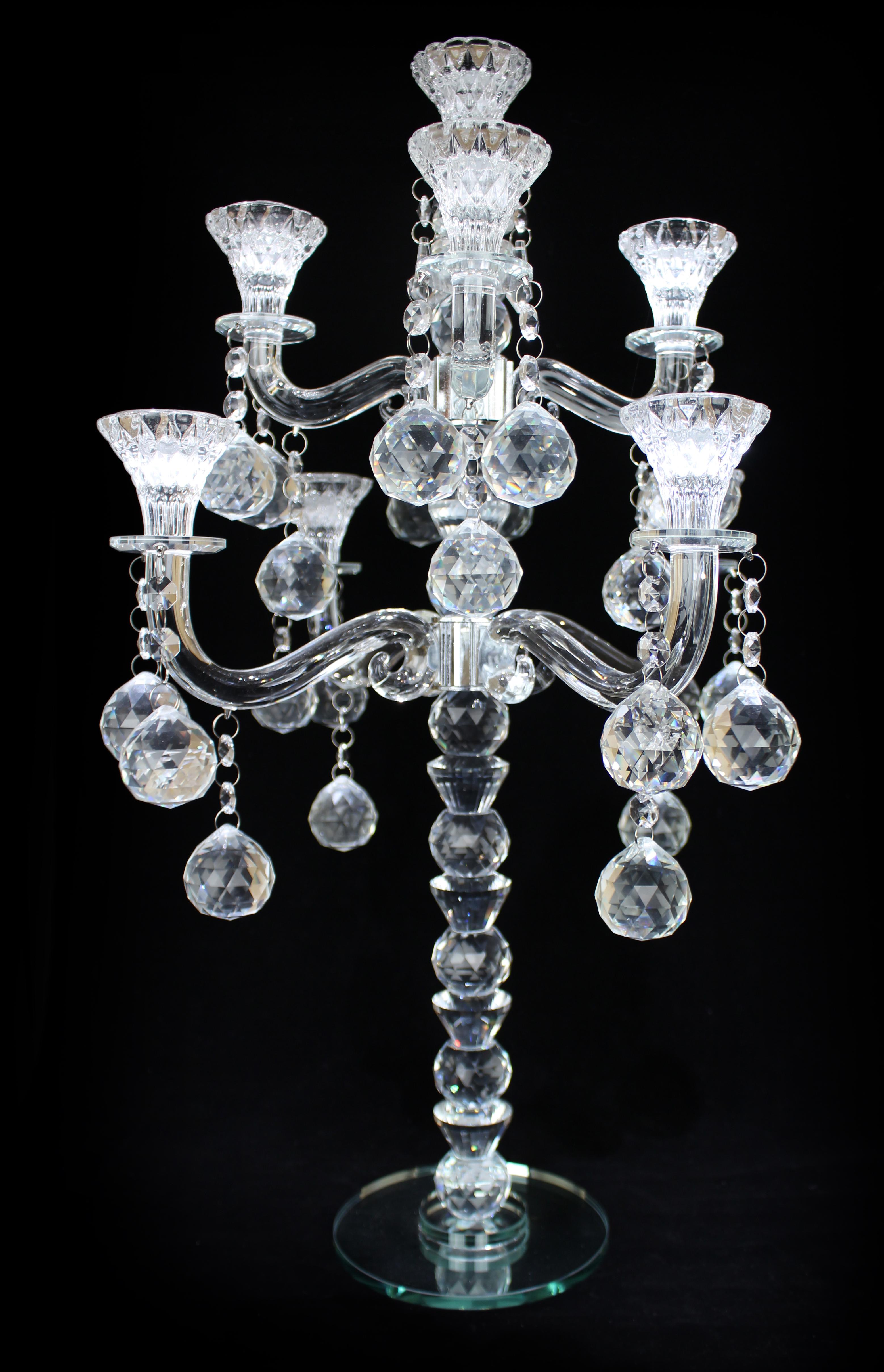 Exquisite 9-Arm Crystal Candelabra – Hollywood Regency Elegance

Elevate your interior with this stunning 9-arm crystal candelabra, a masterpiece of Hollywood Regency design. Crafted from high-quality clear crystal, it features gracefully curved