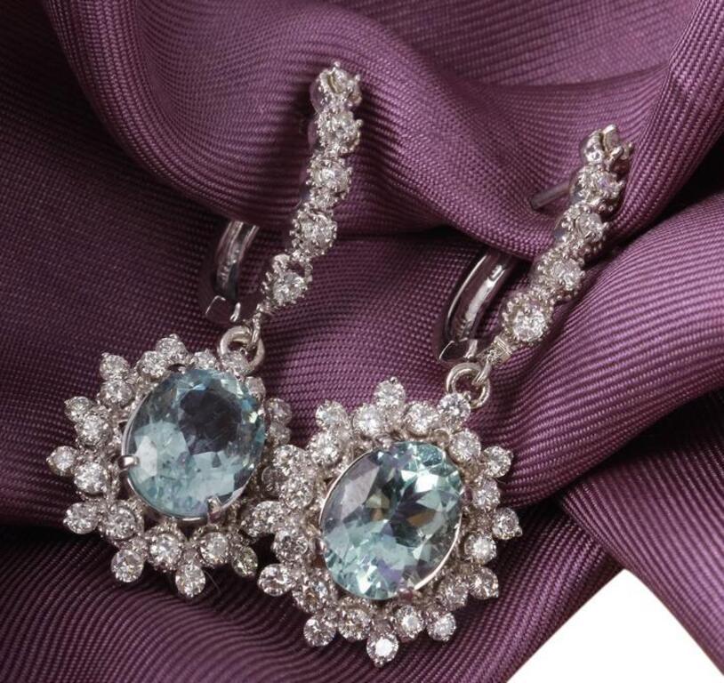 Exquisite 9.60 Carats Natural Aquamarine and Diamond 14K Solid White Gold Earrings

Amazing looking piece!

Total Natural Round Cut White Diamonds Weight: Approx. 1.60 Carats (color G-H / Clarity SI1-SI2)

Total Natural Oval Blue Aquamarines Weight
