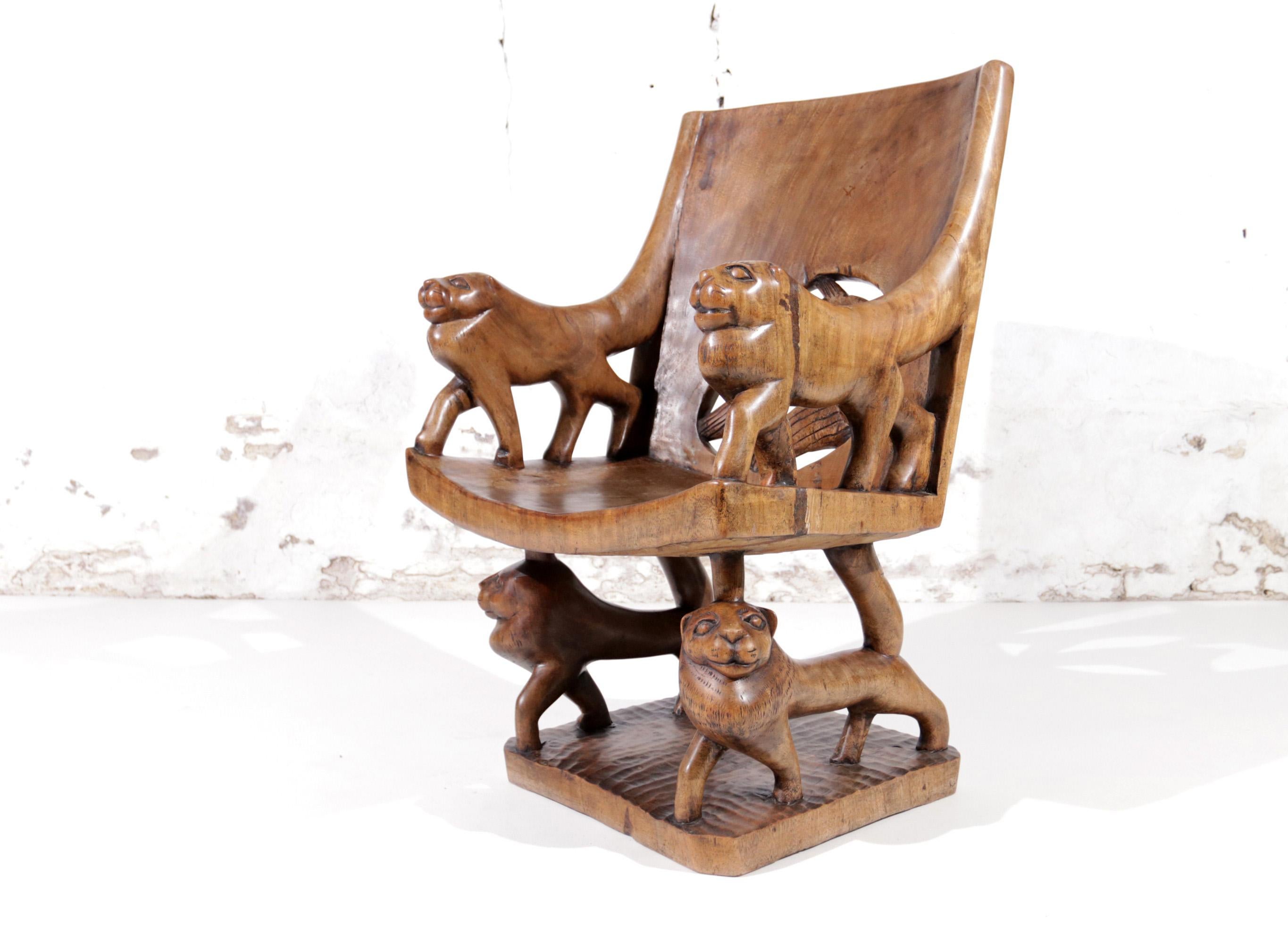 Very exquisite African Sculptural Lion throne made from 1 piece of solid (probably teak) wooden trunk that must have had a circumference of more than 1.5 meters.
We also have the other chair from the same tree trunk and these chairs probably