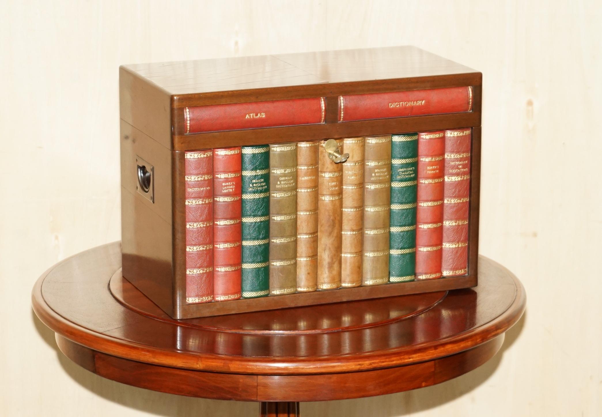 Royal House Antiques is delighted to offer for sale this very rare and highly collectable Alfred Dunhill Faux Book front hidden drinks cabinet with Sparklets soda maker 
A very good looking well made and decorative suite, it comes complete with the