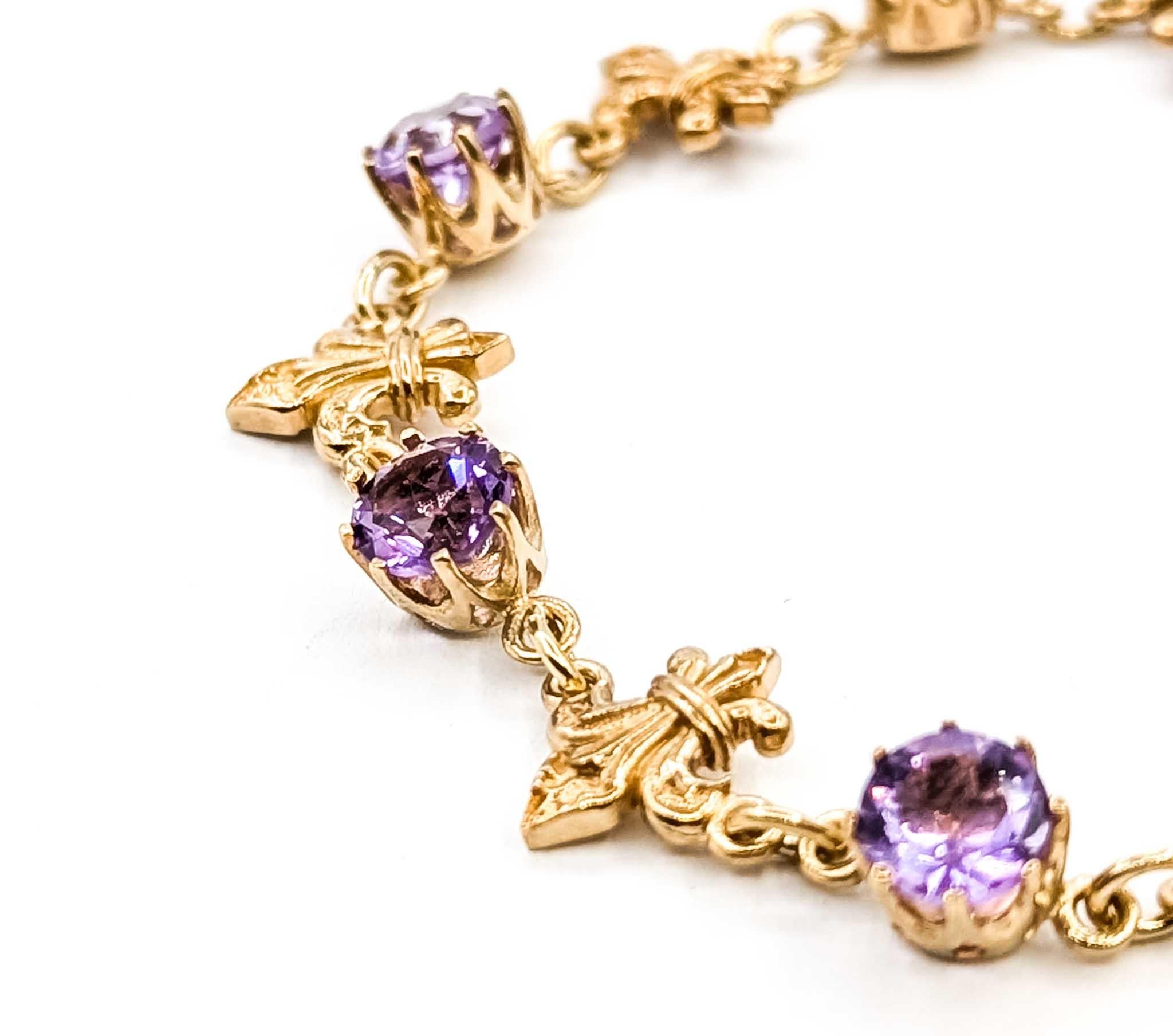 Exquisite Amethyst and 9k Yellow Gold Bracelet

Introducing this exquisite Bracelet Fleur De Lis, meticulously crafted from luxurious 9k yellow gold. This captivating piece showcases the mesmerizing allure of amethysts, with a total carat weight of