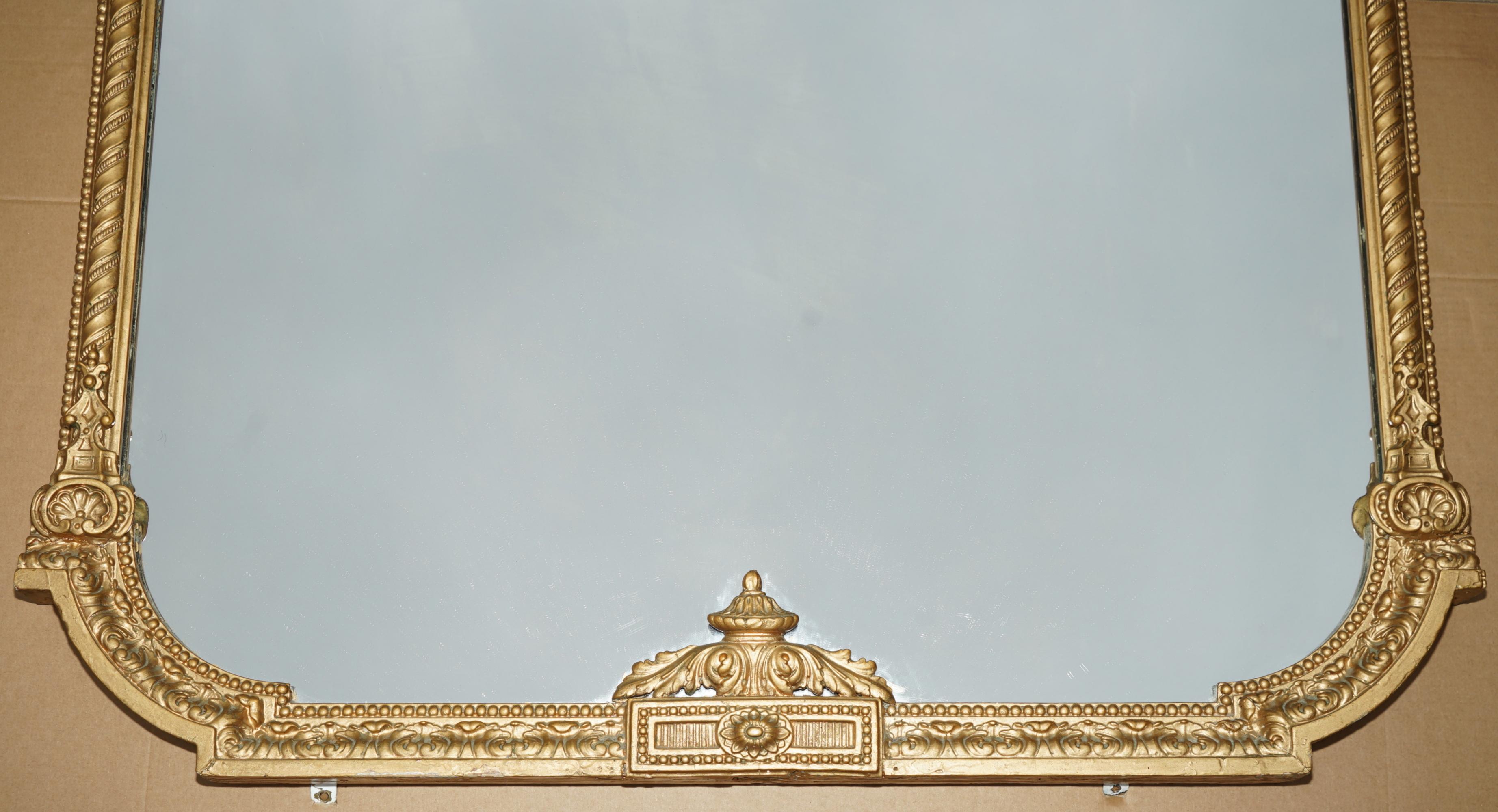 Royal House Antiques

Royal House Antiques is delighted to offer for sale this stunning circa 1860-1880 hand carved Walnut framed overmantel mirror in the Neoclassical taste and with an exquisite gold gilt finish

Please note the delivery fee listed
