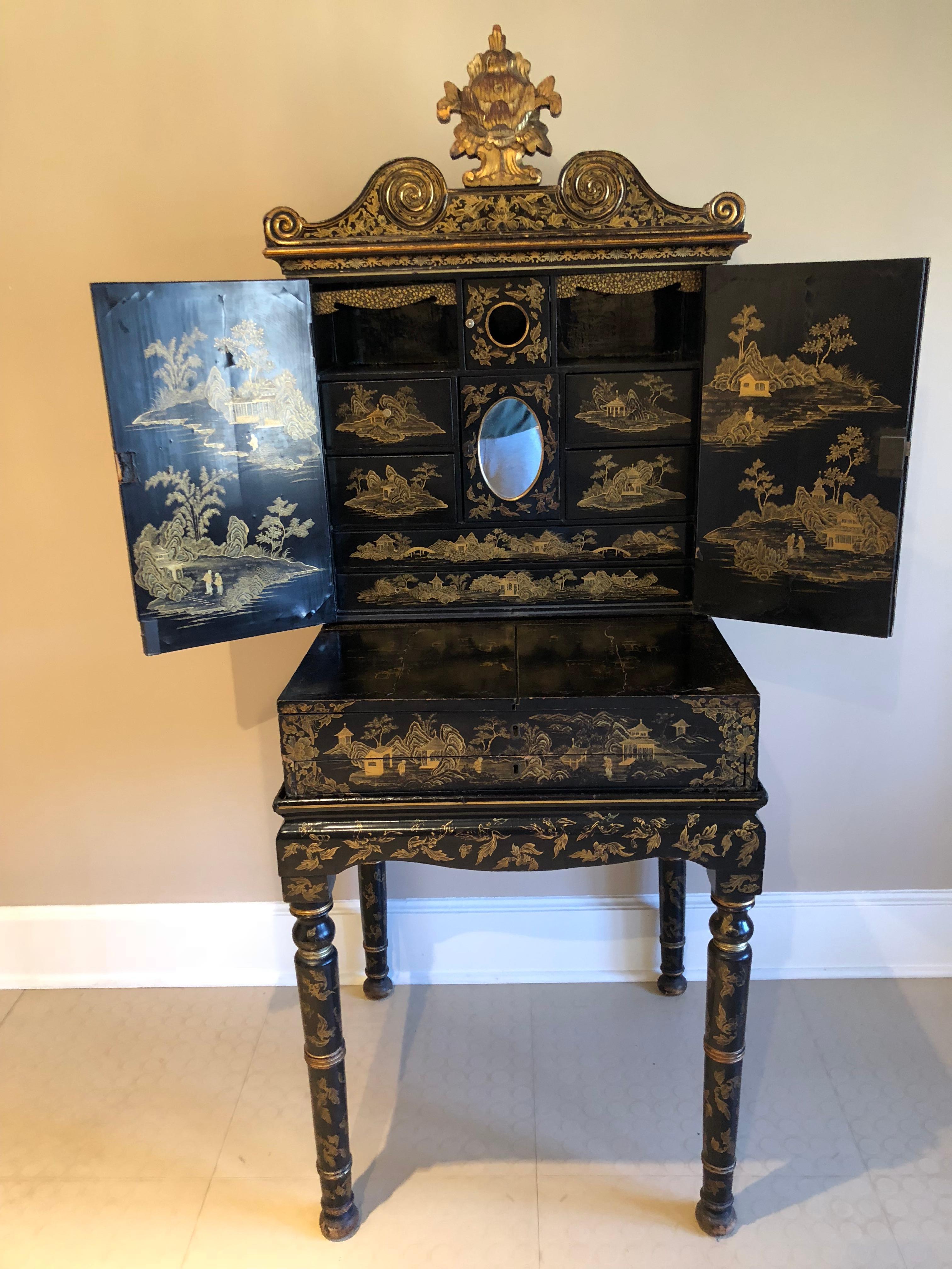 Outstanding late 19th century Chinese export gilt decorated black lacquer cabinet on stand. The detail of the gilt work on this piece is extraordinary. As shown in photos, this piece is comprised of three sections: a table base; a cabinet with