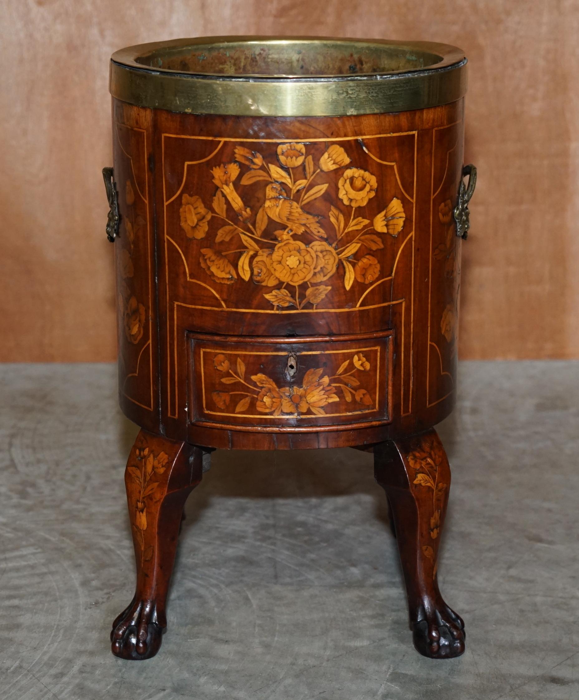 We are delighted to offer for sale this very rare circa 1800 Dutch inlaid wine cooler with original brass bucket and single drawer

A rare, collectable and good looking antique which fits well in any setting. This piece has exquisite marquetry