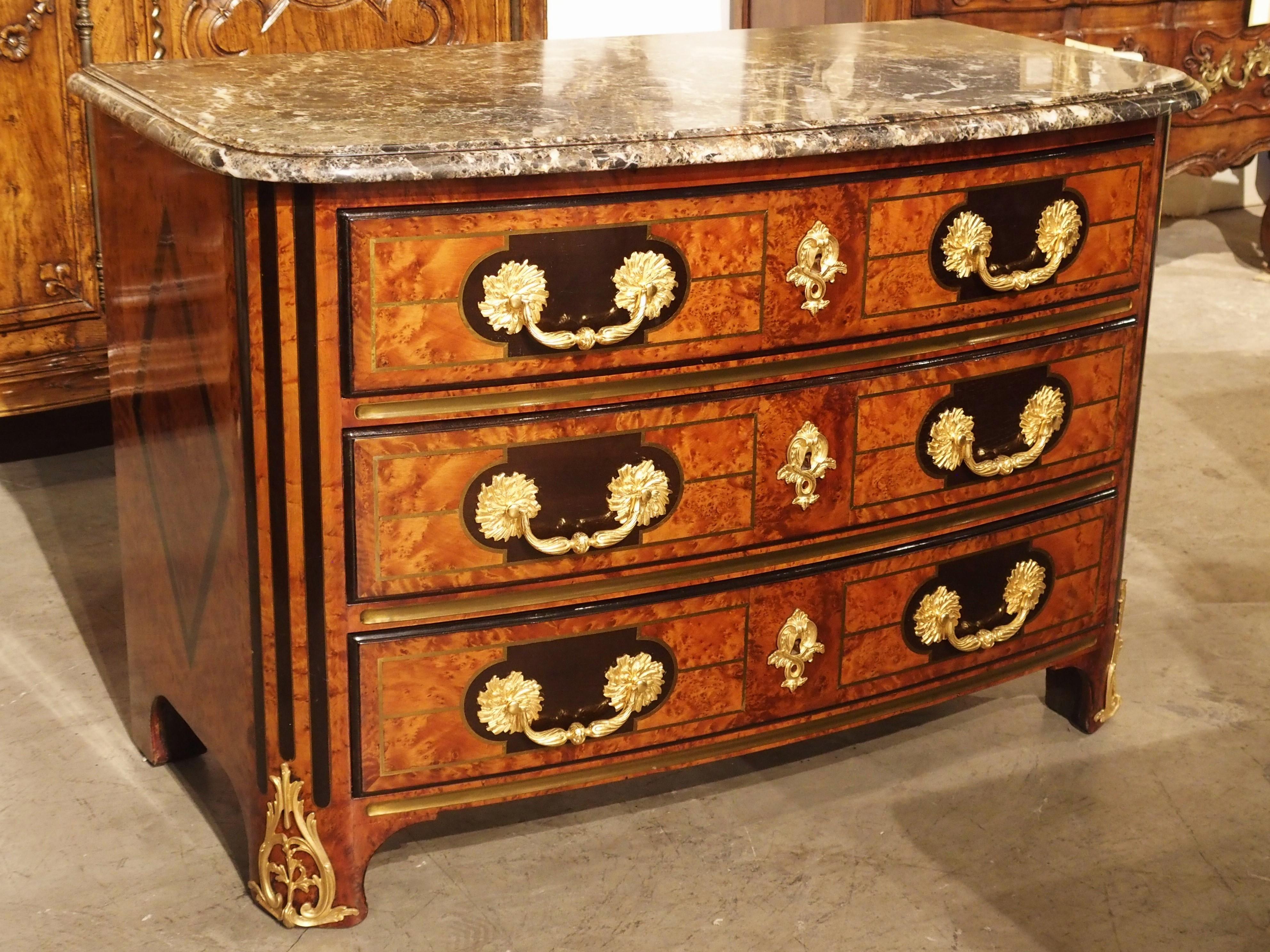 This rich, French commode, or chest of drawers, is a late 19th century production from a high quality ebenisterie in Paris.  The fire stamp (makers mark) on the rear left of the piece reads “BR A PARIS”.  This firm was likely situated in the