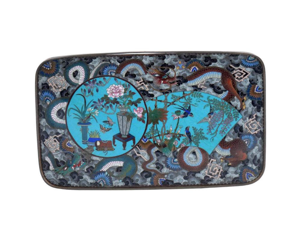 An antique Japanese, late Meiji era, enamel over copper tray. The interior of the ware is adorned with a polychrome enamel design representing figural medallions depicting plants in pots and birds in blossoming flowers on the turquoise ground