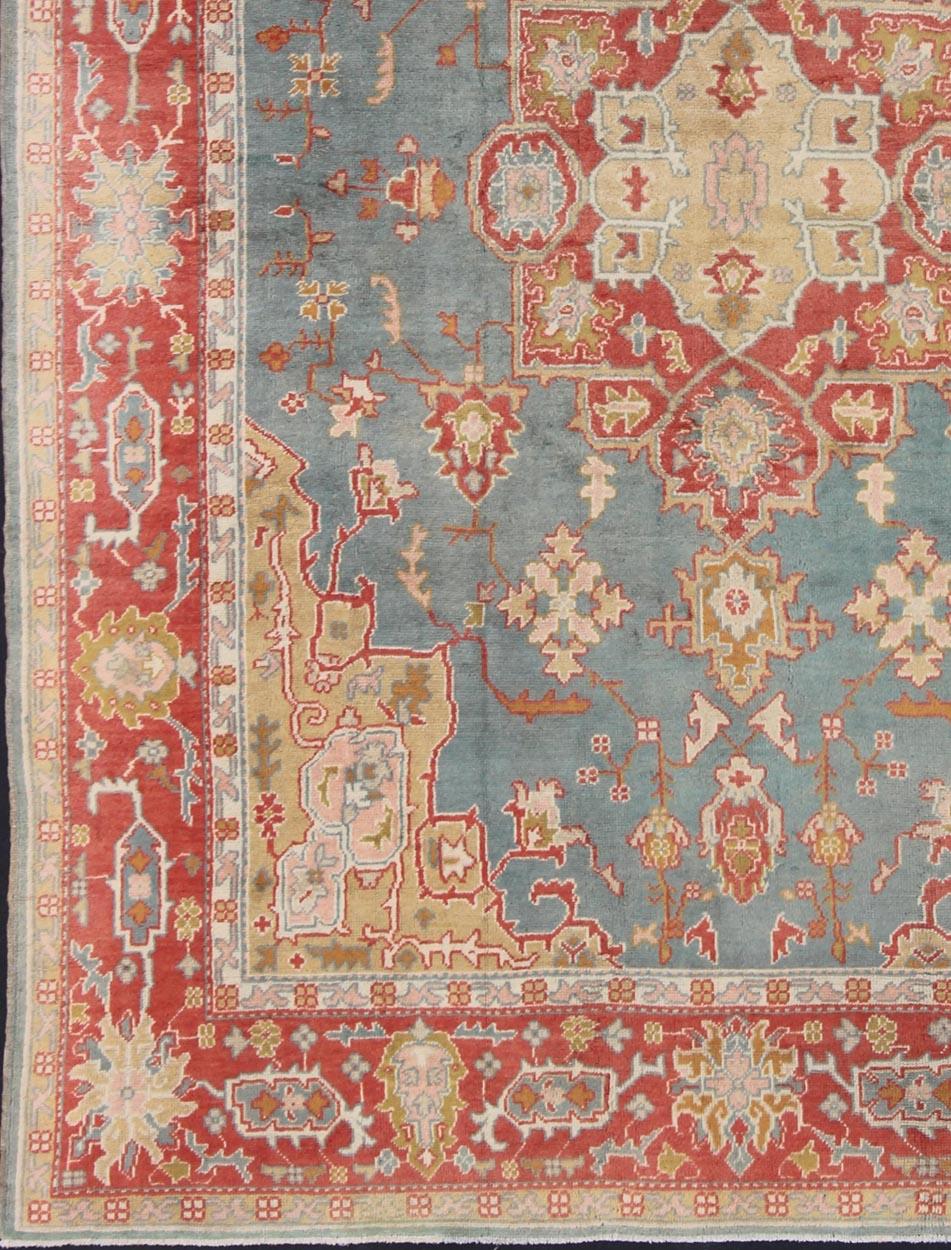  Antique Turkish Oushak Rug On A Blue Background and Orange-Red Color Border. Keivan Woven Arts / rug BHR-1, country of origin / type: Turkey / Oushak, circa Early-20th century. 
Measures: 9'9 x 13'1 
This antique Turkish Oushak bears a remarkable