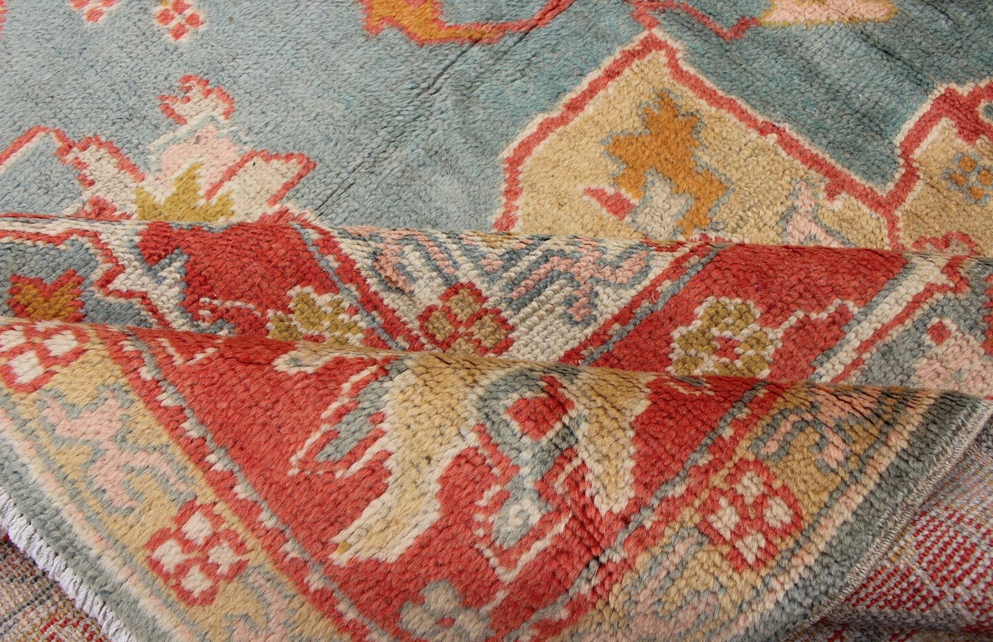 20th Century  Antique Turkish Oushak Rug On A Blue Background and Orange-Red Color Border For Sale