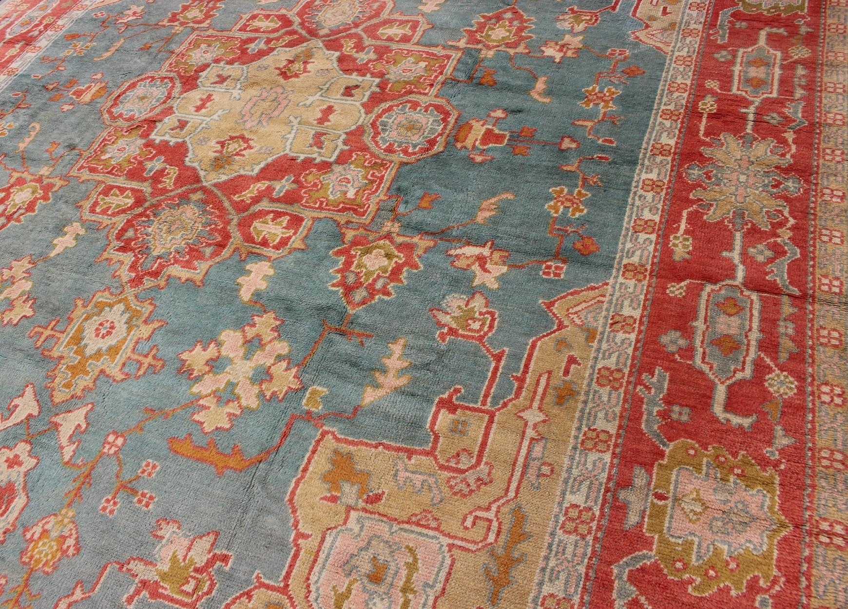  Antique Turkish Oushak Rug On A Blue Background and Orange-Red Color Border For Sale 2