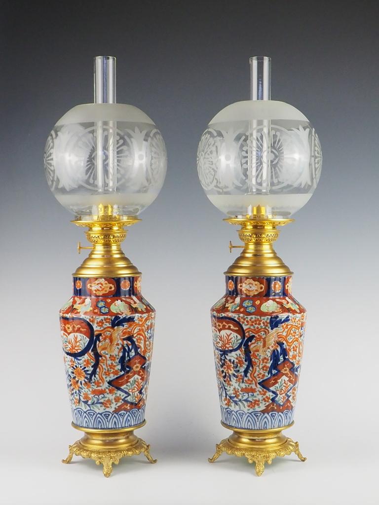 Exquisite Antique Pair of Japanese Imari Porcelain Oil Table Lamps

This exquisite pair of antique oil table lamps embodies the timeless artistry of Japanese Imari porcelain. Crafted in the famed Arita region, these lamps showcase the masterful