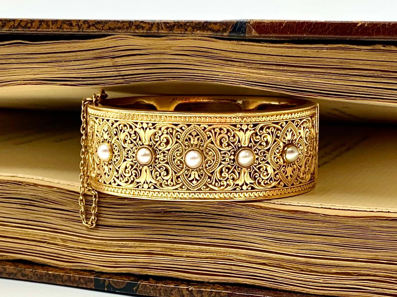 Exquisite antique reticulated 18K yellow gold five pearl Alhambra bracelet 
Circa 1870
The front of this superb bracelet is composed of an incredibly detailed reticulated 18K gold Moorish style panel echoing the designs of the Sala de los Reyes, the