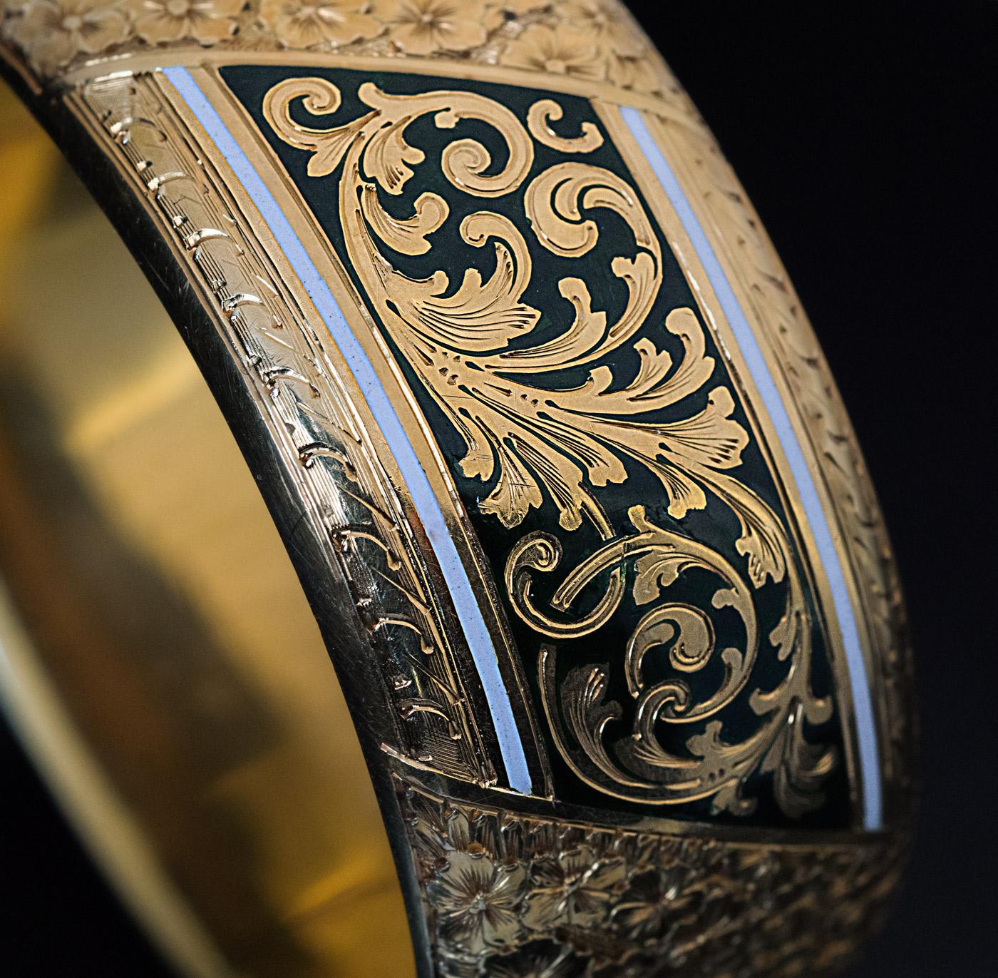 Circa 1890

The design of this late Victorian era superbly crafted cuff bracelet is influenced by Renaissance Revival and Art Nouveau styles of the late 19th century. The bracelet is centered with a wide band of superbly hand-engraved gold