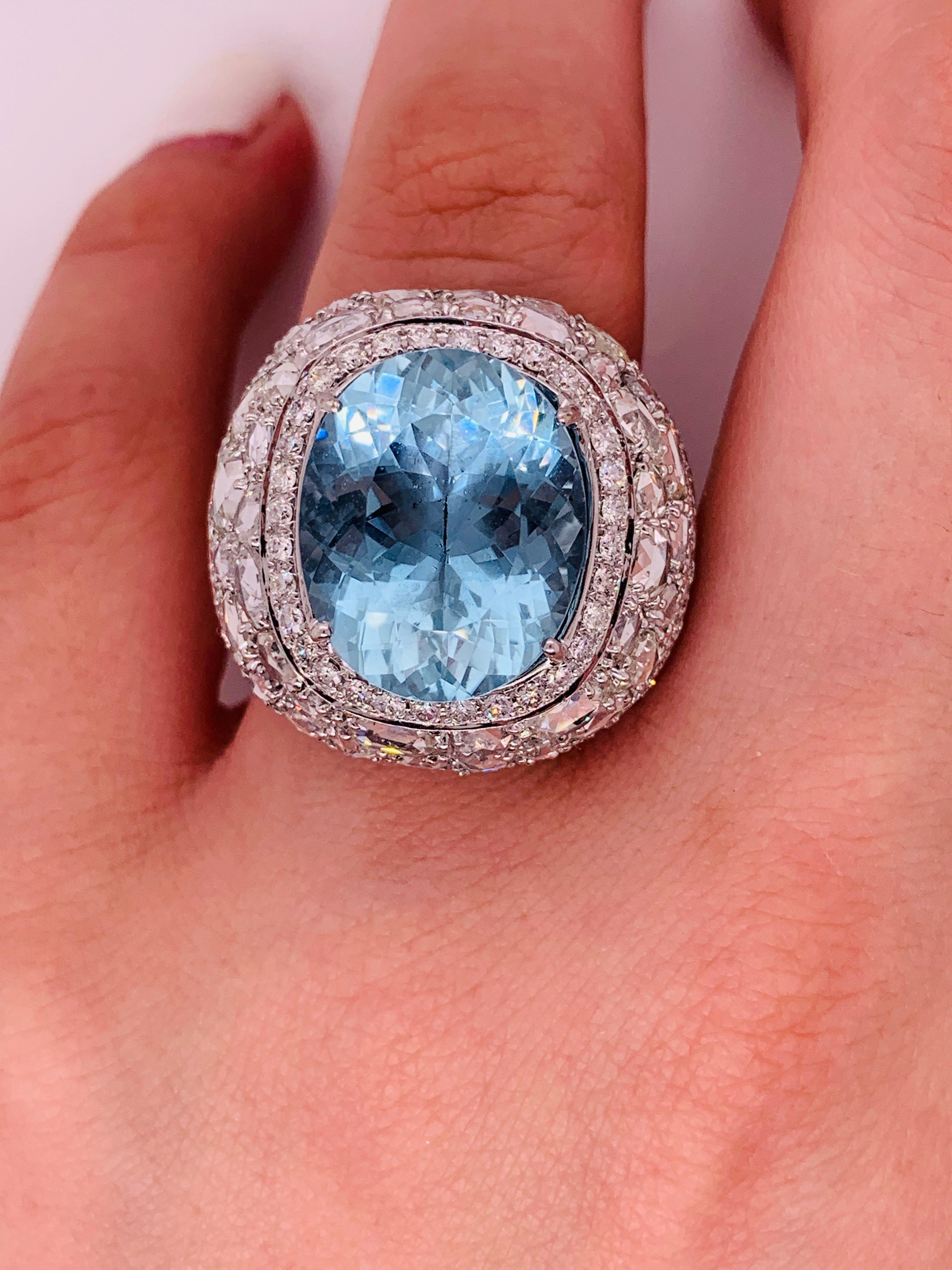 Exquisite Aquamarine and Rose cut Diamond ring
18K white gold ring with aquamarine center stone surrounded by rose and round brilliant cut diamonds.
Composition:
18K white gold
13.46 carat aquamarine
6.00 ct diamonds
Can be resized to any