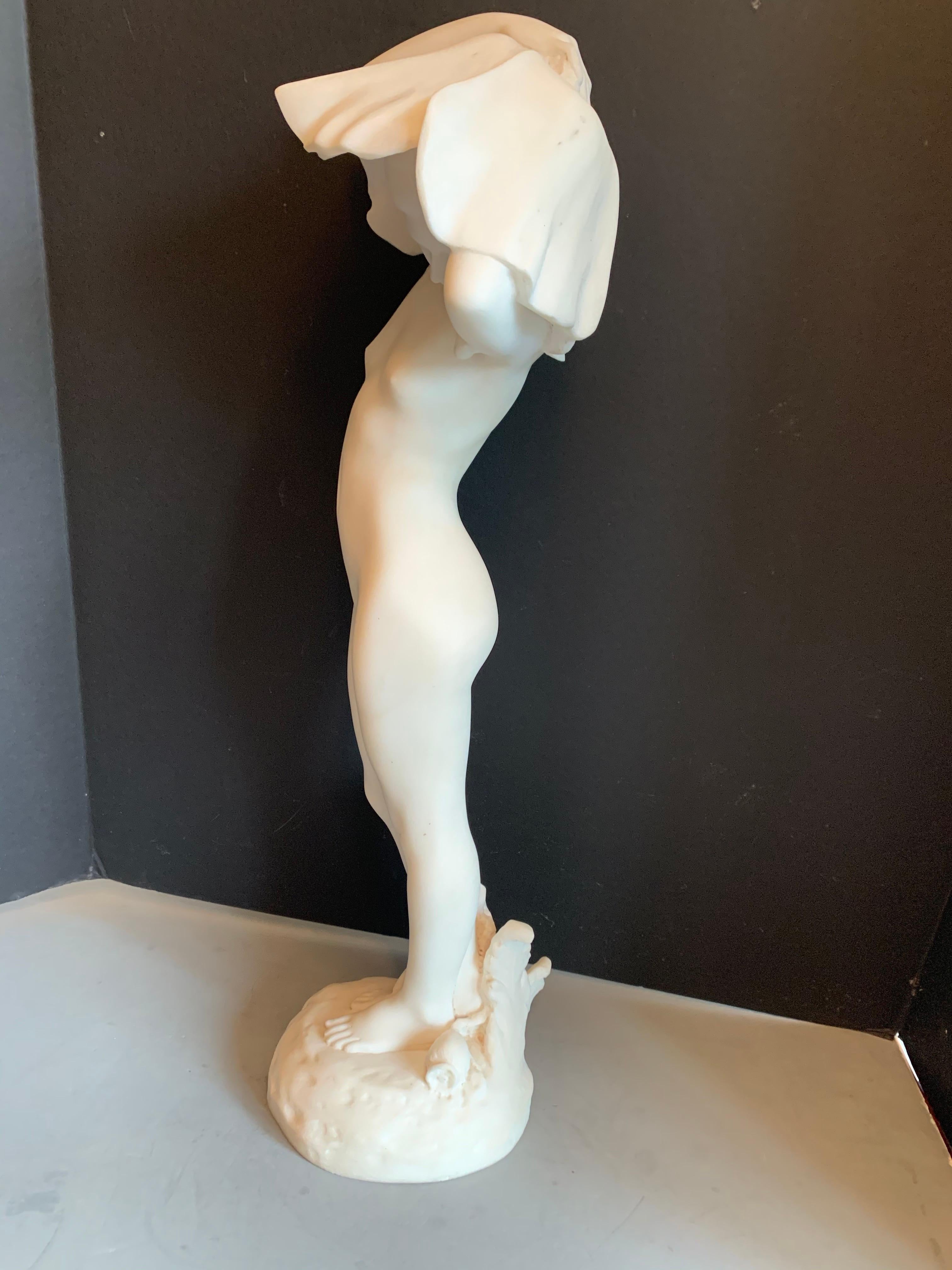 A rare Nouveau classical figure of a young female nude with poppies. Beautifully hand carved in white marble, circa 1895, European the base is 6.5 inches in diameter with a total height of 23.5.
