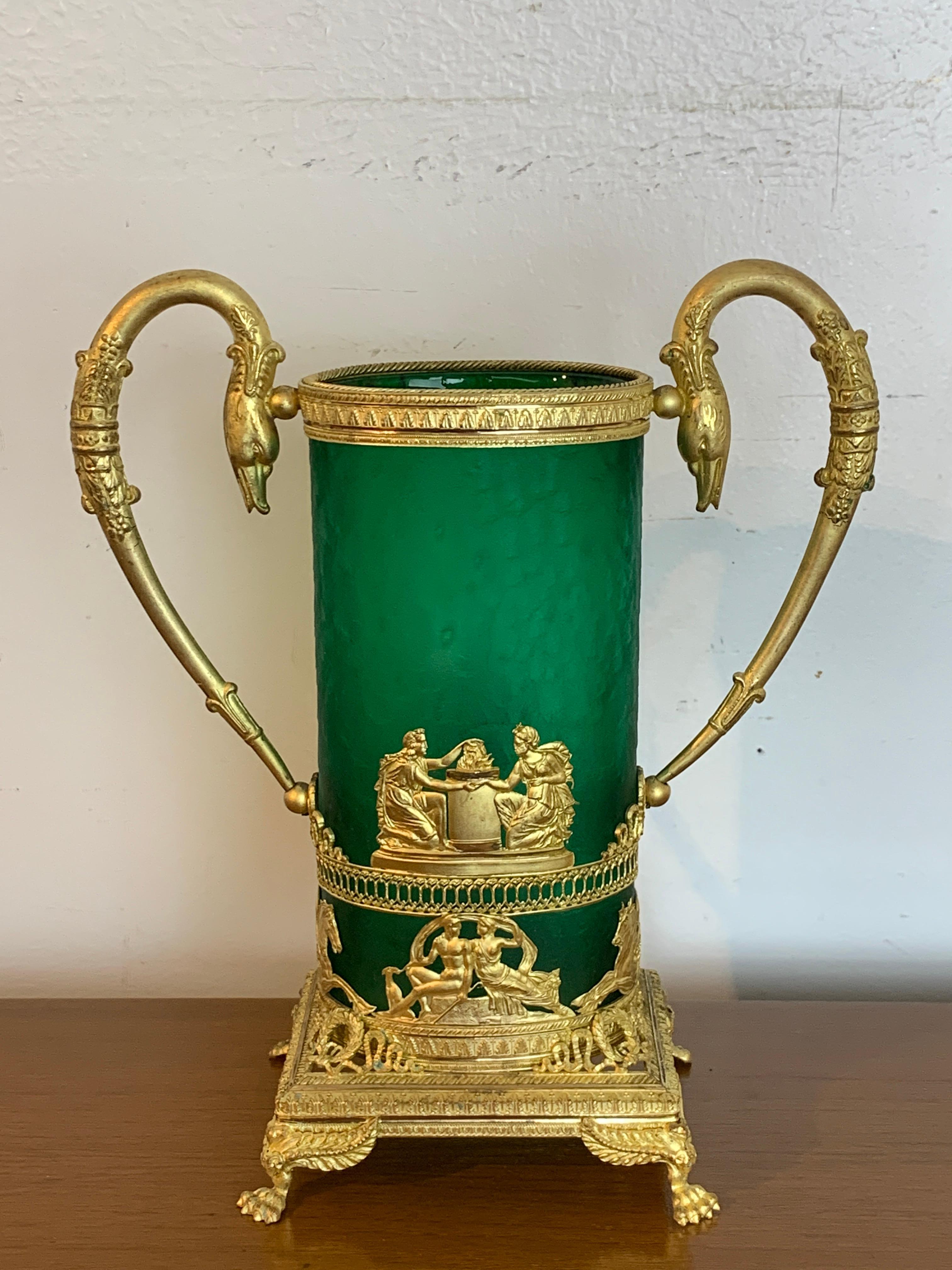 Empire Ormolu-mounted Baccarat Vase with oval green acid cut back stippled /cameo glass vase with intricate ormolu mounts with robust swan handles, raised on winged paw feet. Unmarked.
 