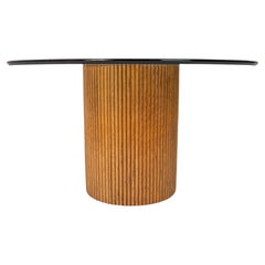 Exquisite Bamboo Pedestal Dining Table with a Mirrored Top with a Glass Surface