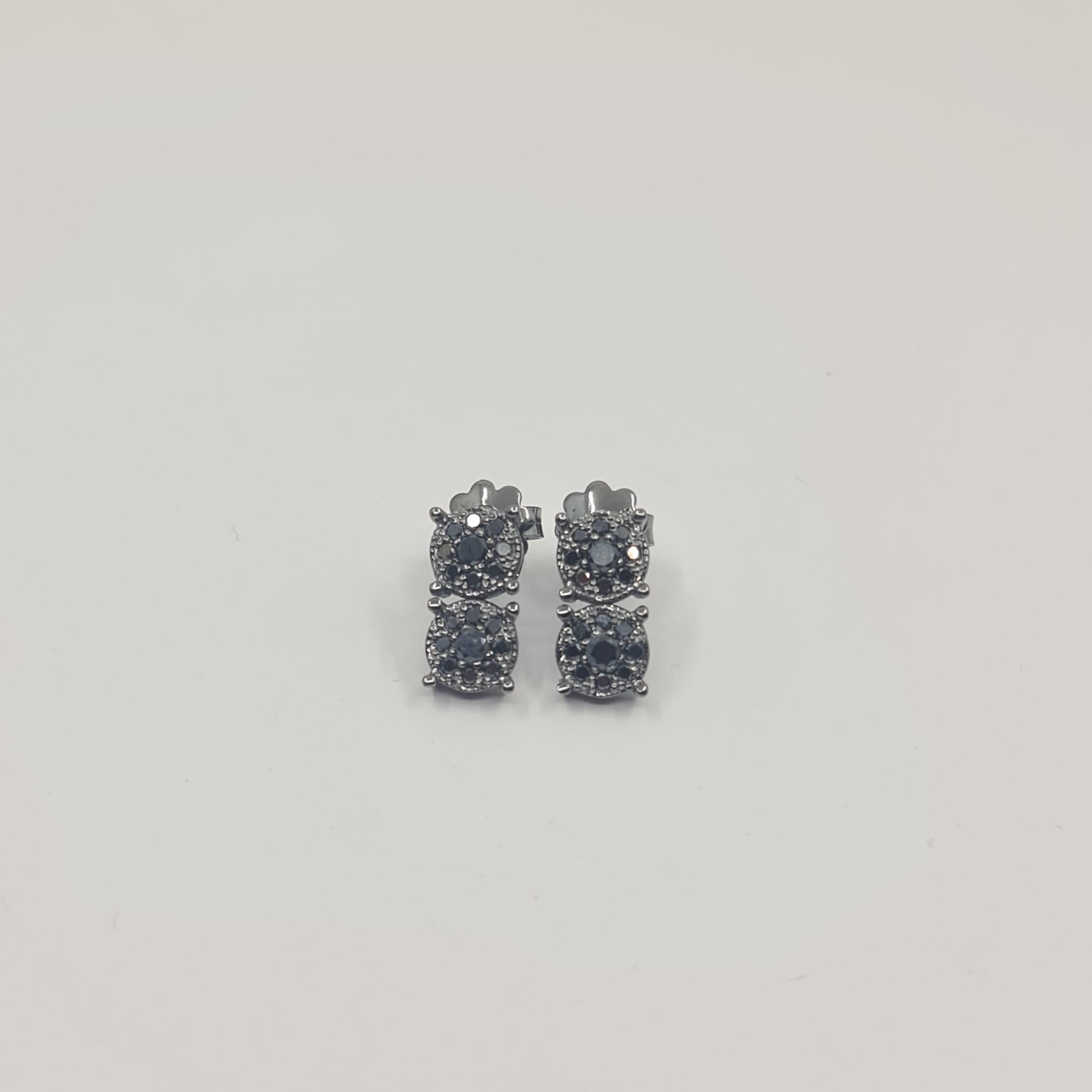 Exquisite Black Diamond Earrings 0.57 Carat in 18K Black Gold Round Cut

Black is Beautiful. Black is Powerful.
We are very excited to introduce our brand new BLACK STARS collection worldwide! 
All Black Diamonds set in Black Coated 18K Gold. 
Pure